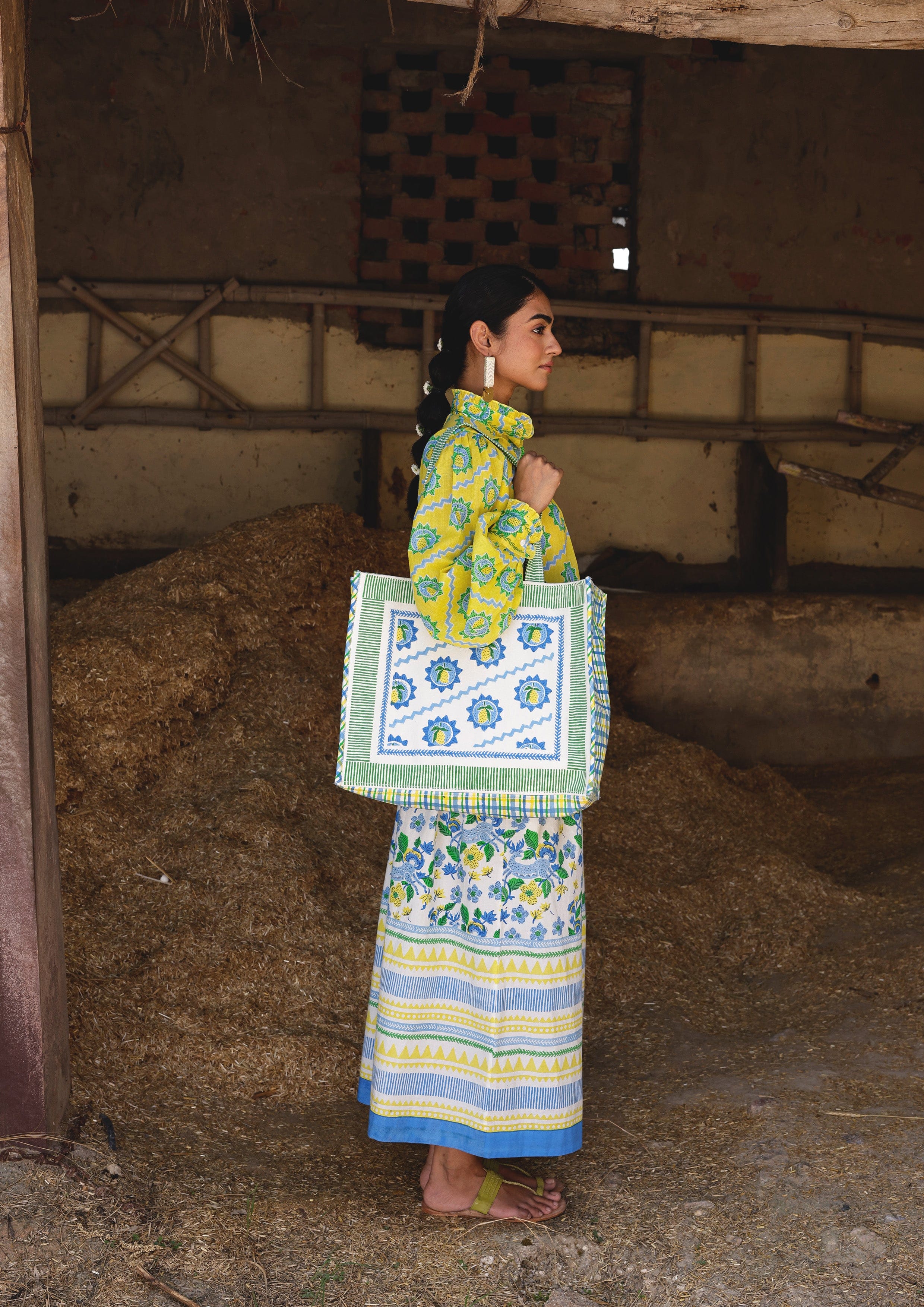 Mango block print tote bag from The Raw India featuring vibrant fabric and sturdy handles for everyday use.