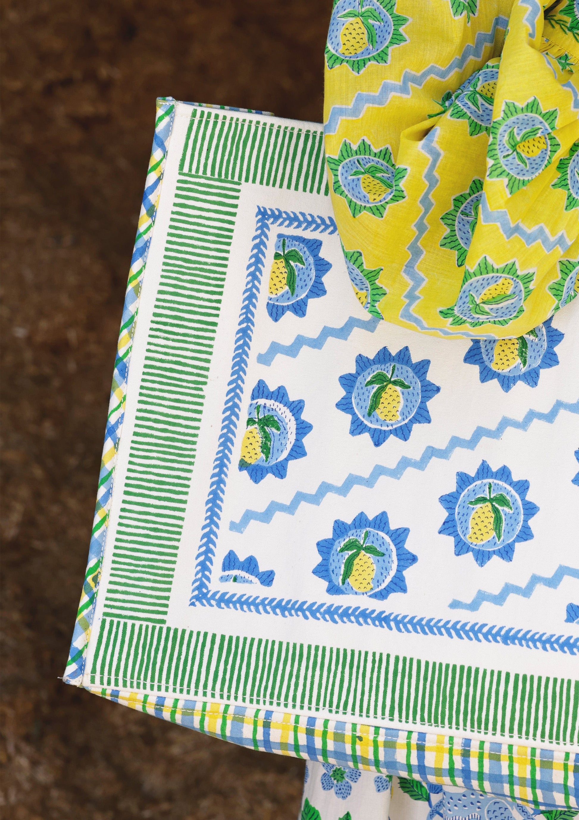 Mango block print tote bag from The Raw India featuring colorful, handcrafted fabric with sturdy handles and spacious interior.