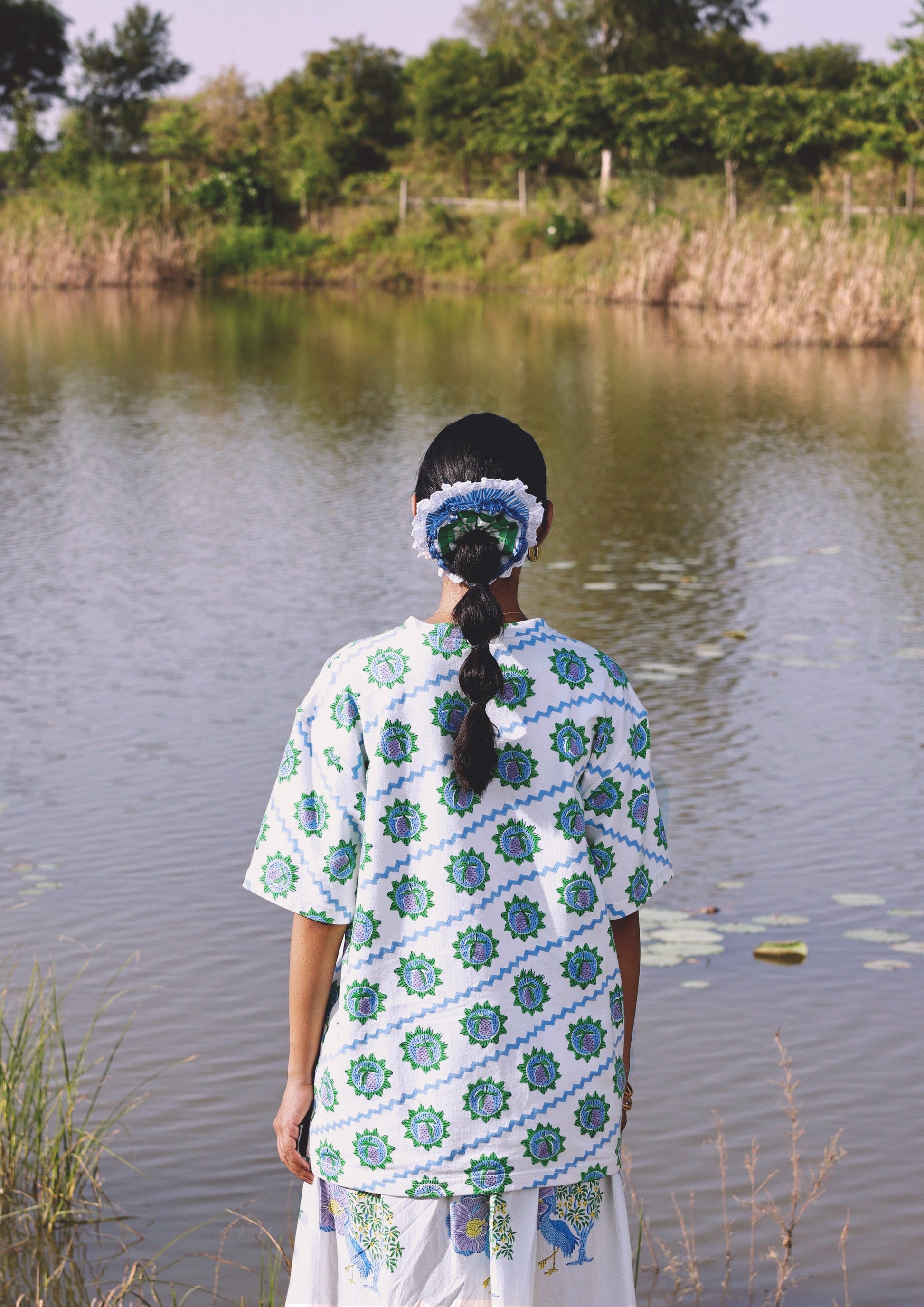 Blue Mango T-shirt from The Raw India, casual top with a relaxed fit, featuring a simple crew neckline and soft fabric.
