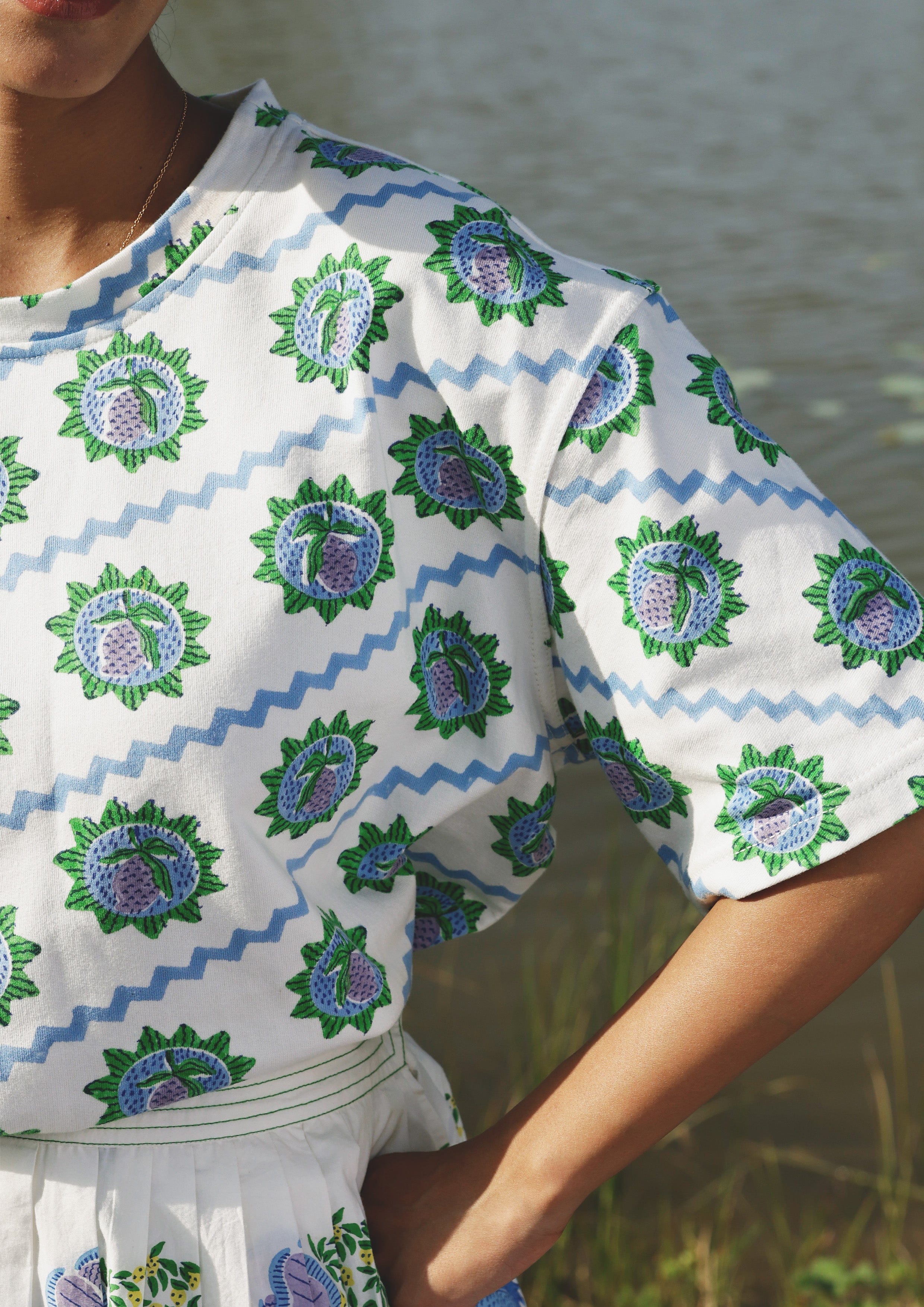 Blue Mango T-shirt by The Raw India, casual top with round neckline and short sleeves, displayed on a neutral background.