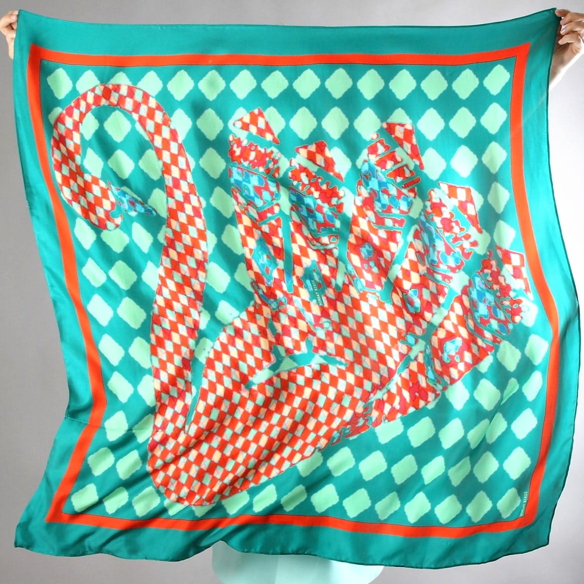Elegant silk foulard featuring an enchanted swan design, by Bombaybirds, showcasing detailed bird and floral patterns.