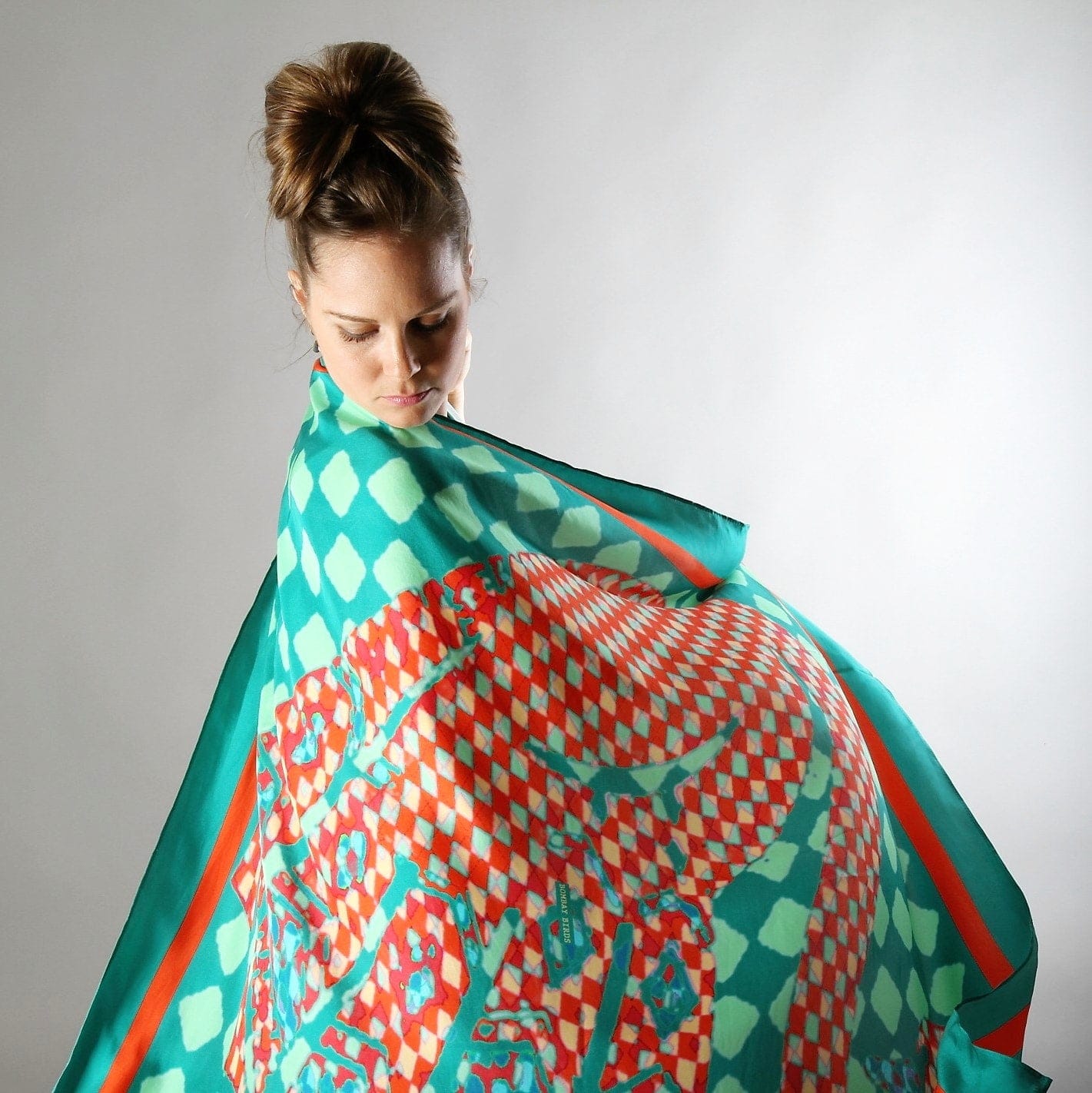 Elegant Bombaybirds The Enchanted Swan foulard scarf with intricate swan and floral patterns in vibrant colors.
