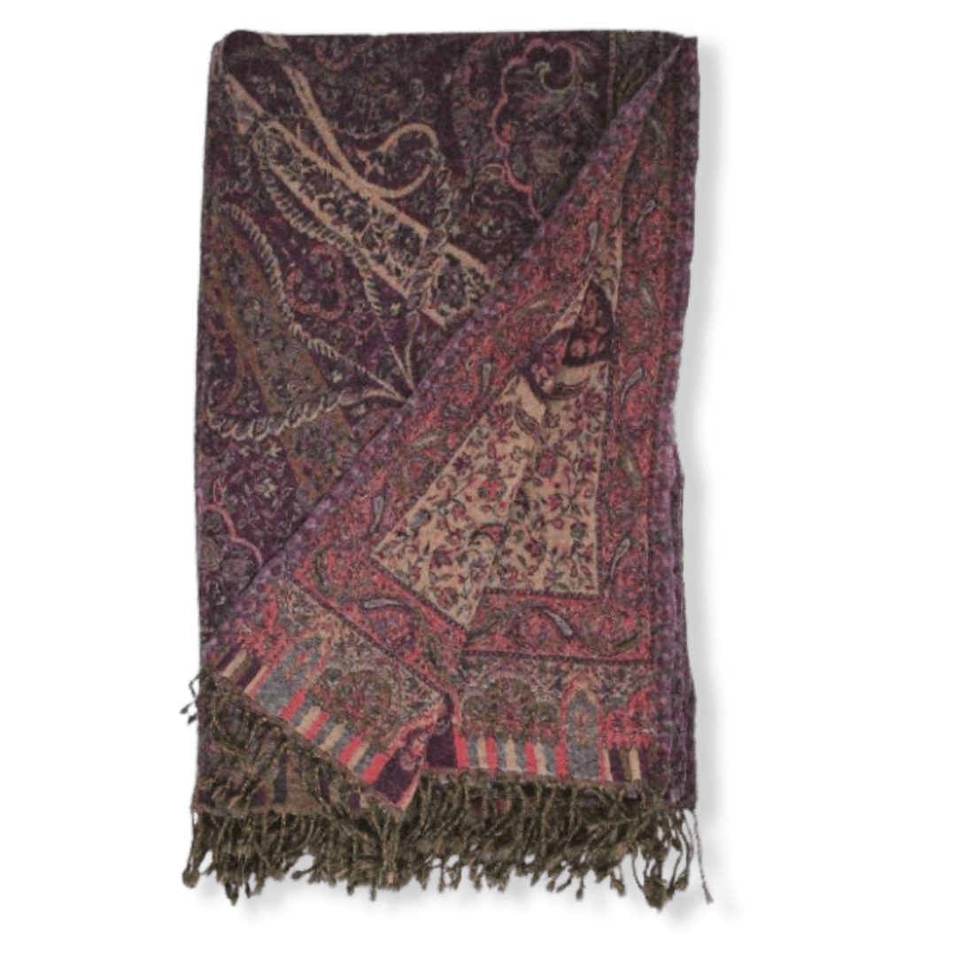Bombaybirds Bordeaux and beige wool throw blanket draped over a sofa, showcasing soft, cozy texture and elegant design.