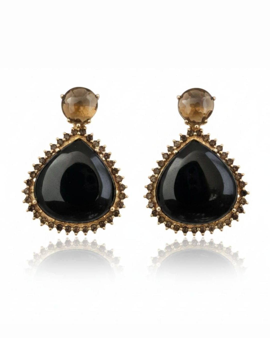 Bombaybirds Zaarah earrings with intricate gold-toned design, featuring elegant dangling elements and detailed craftsmanship.
