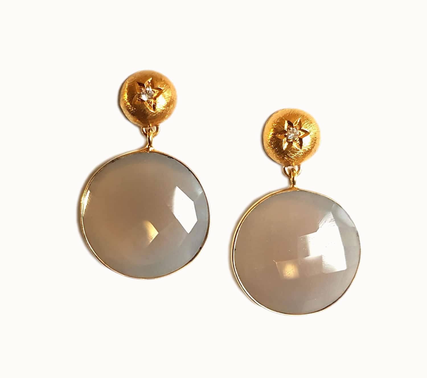 Gray Akit earrings by Bombaybirds featuring intricate design and lightweight metal craftsmanship.