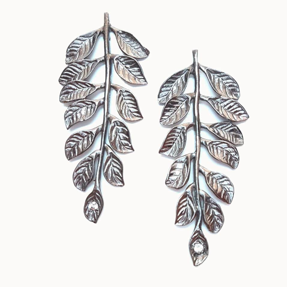 Black Apollo earrings by Bombaybirds with white topaz accents, stylish and elegant jewelry for pierced ears.