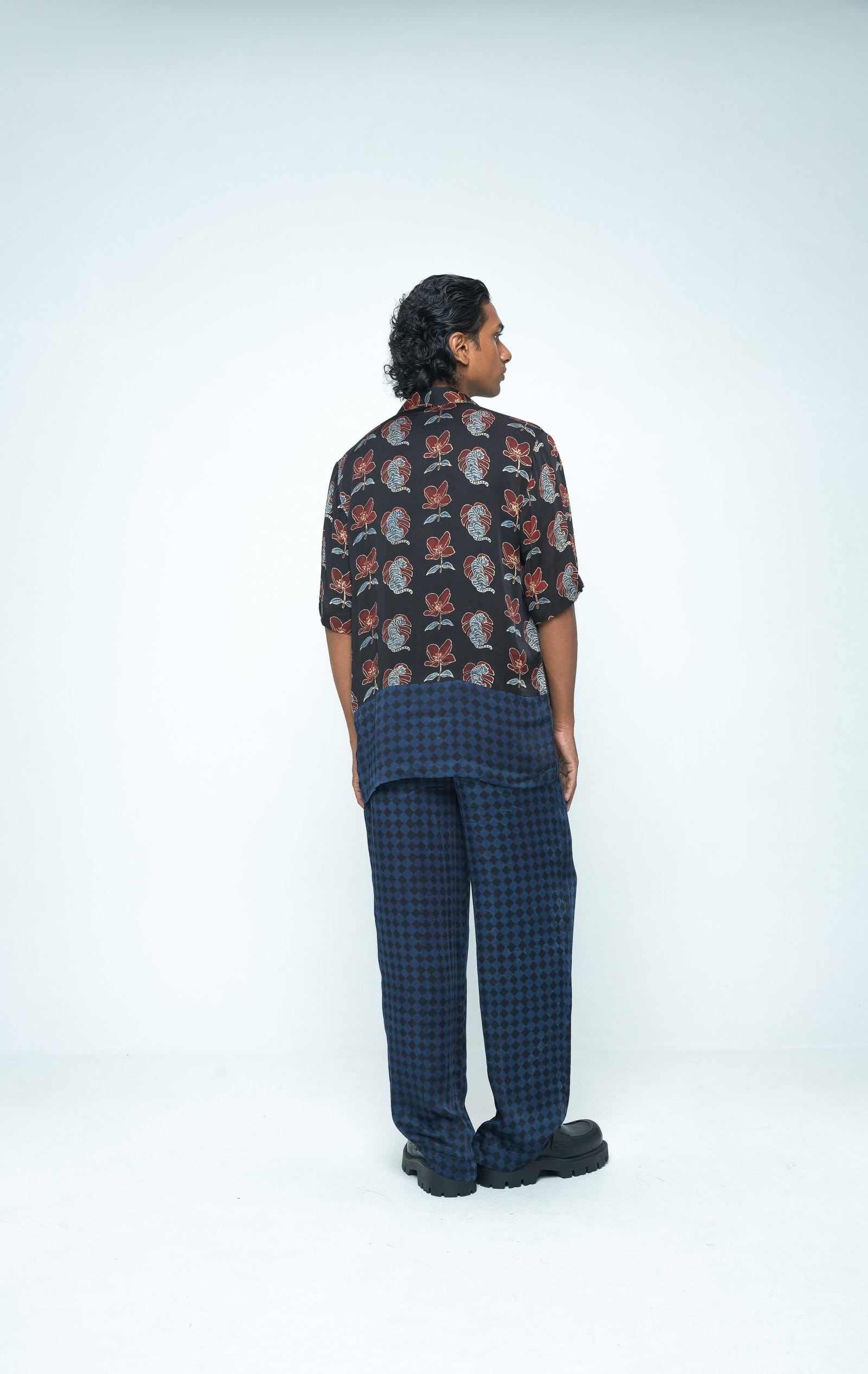 Back view of Anushe Pirani Beast shirt showcasing stylish design and fit, made from comfortable fabric.