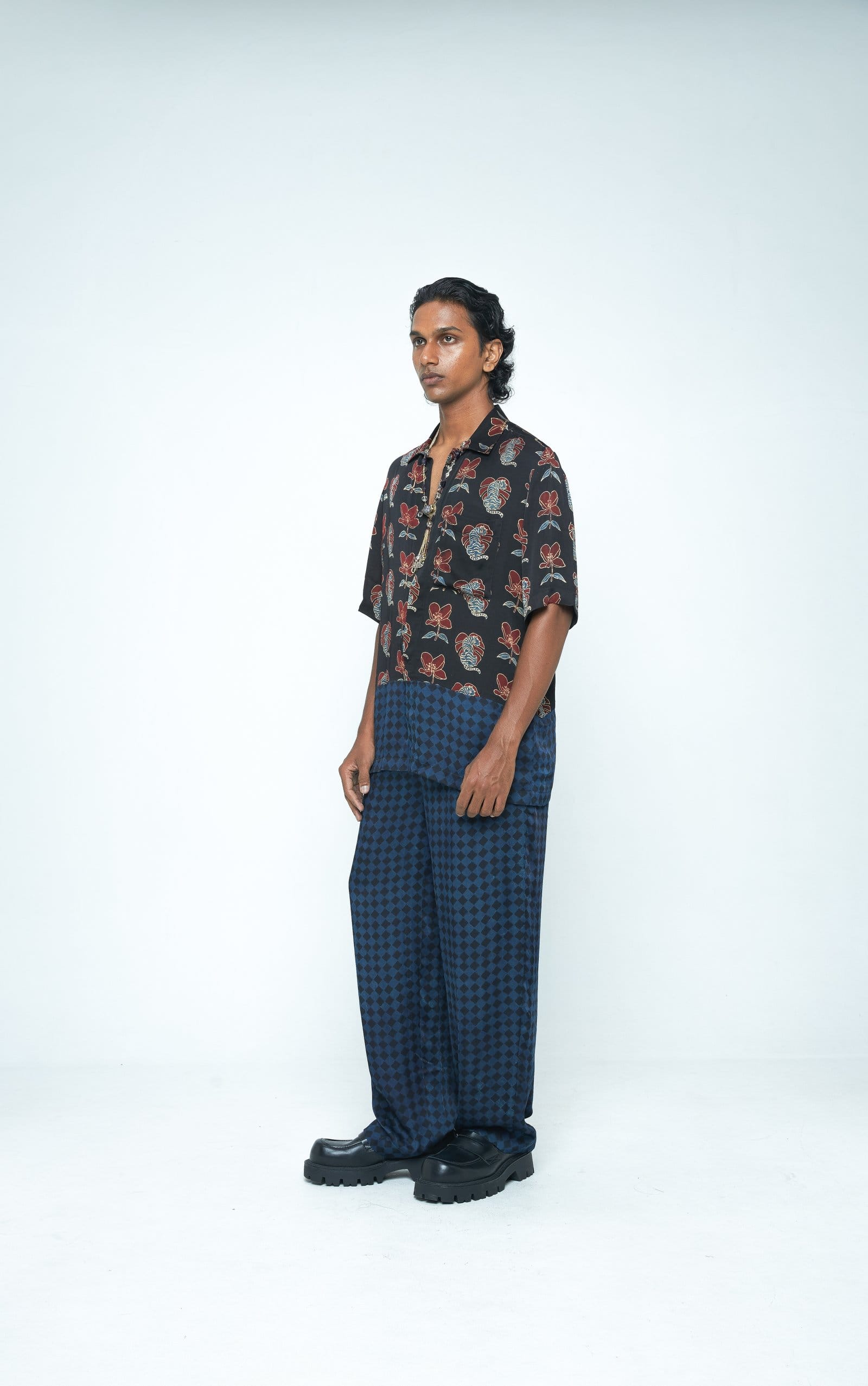 Beast shirt by Anushe Pirani featuring a stylish, fitted design with bold graphic details, shown from a side view.