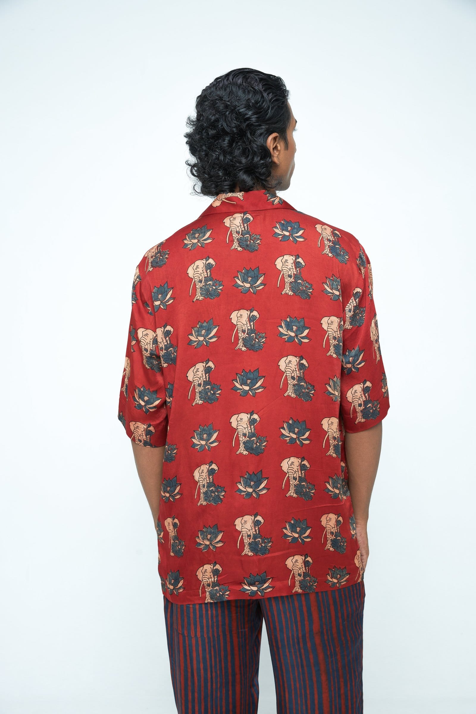 Back view of Anushe Pirani giant lotus shirt, showcasing the detailed lotus design on the navy blue cotton shirt.
