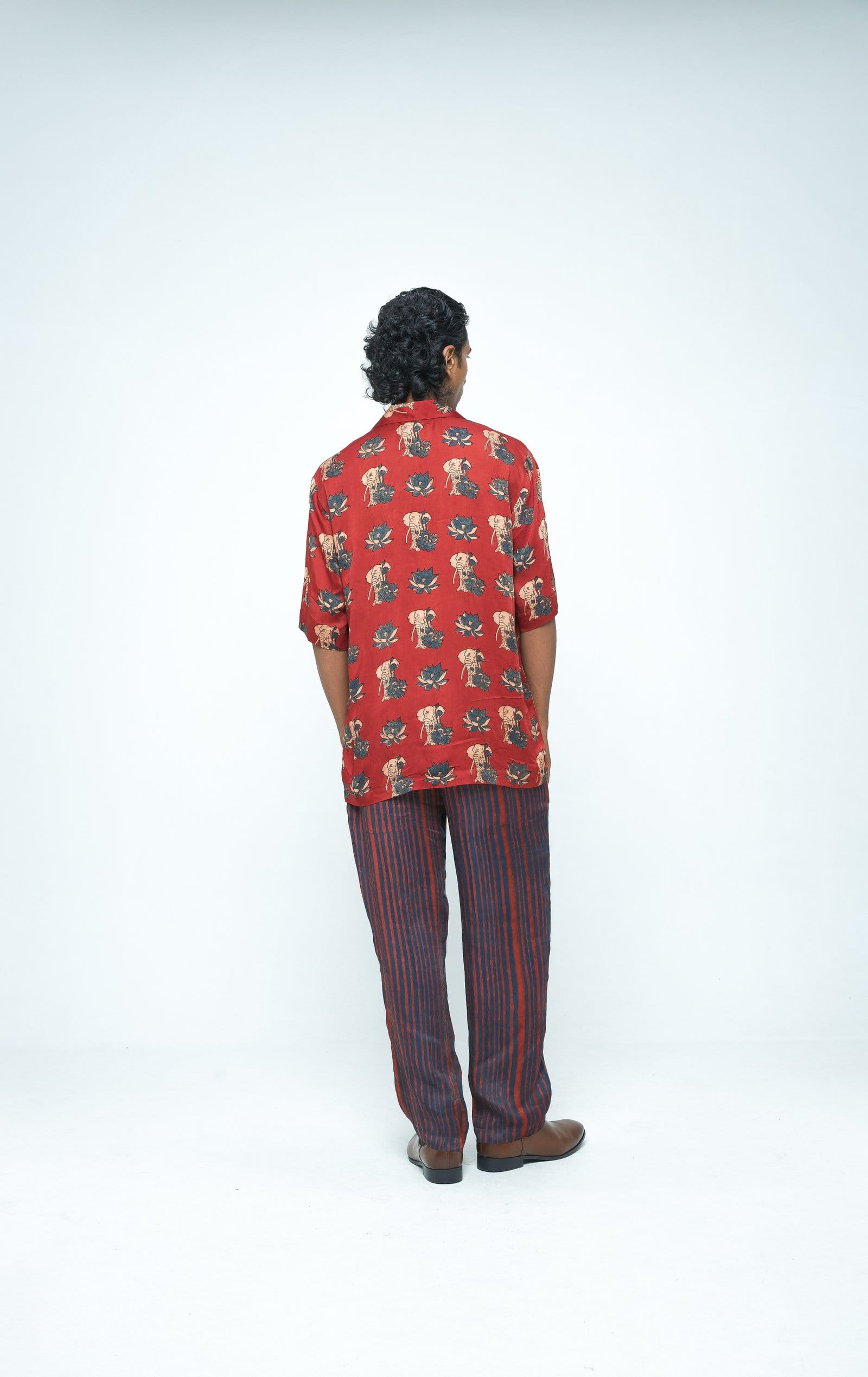 Back view of Anushe Pirani giant lotus shirt featuring a bold lotus design on a stylish shirt.