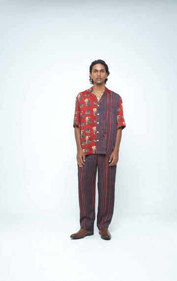 Front view of Anushe Pirani giant lotus shirt featuring a vibrant lotus blossom design on lightweight fabric.