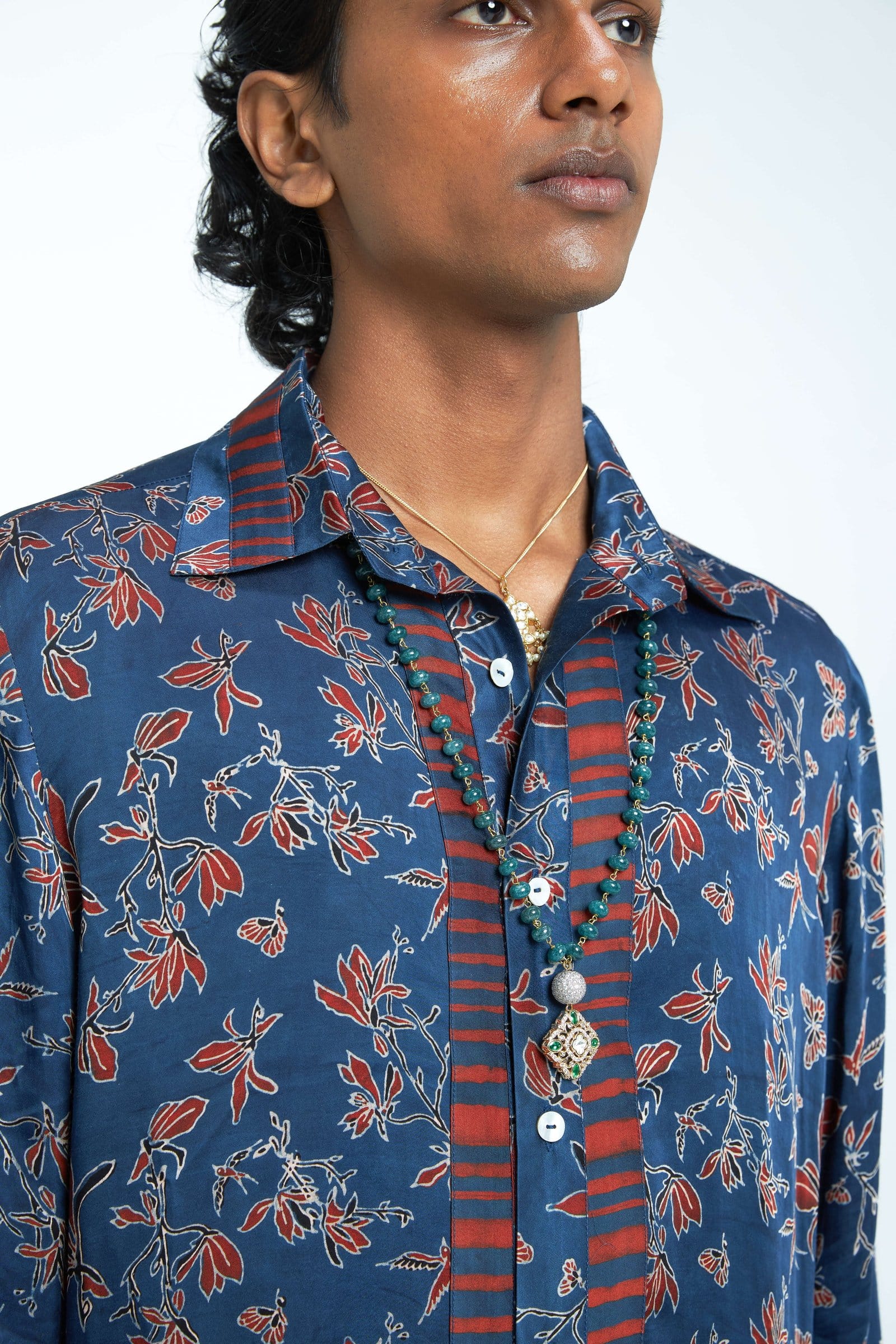 Close-up of the Anushe Pirani Eden shirt showing detailed fabric and stitching in a natural pose.