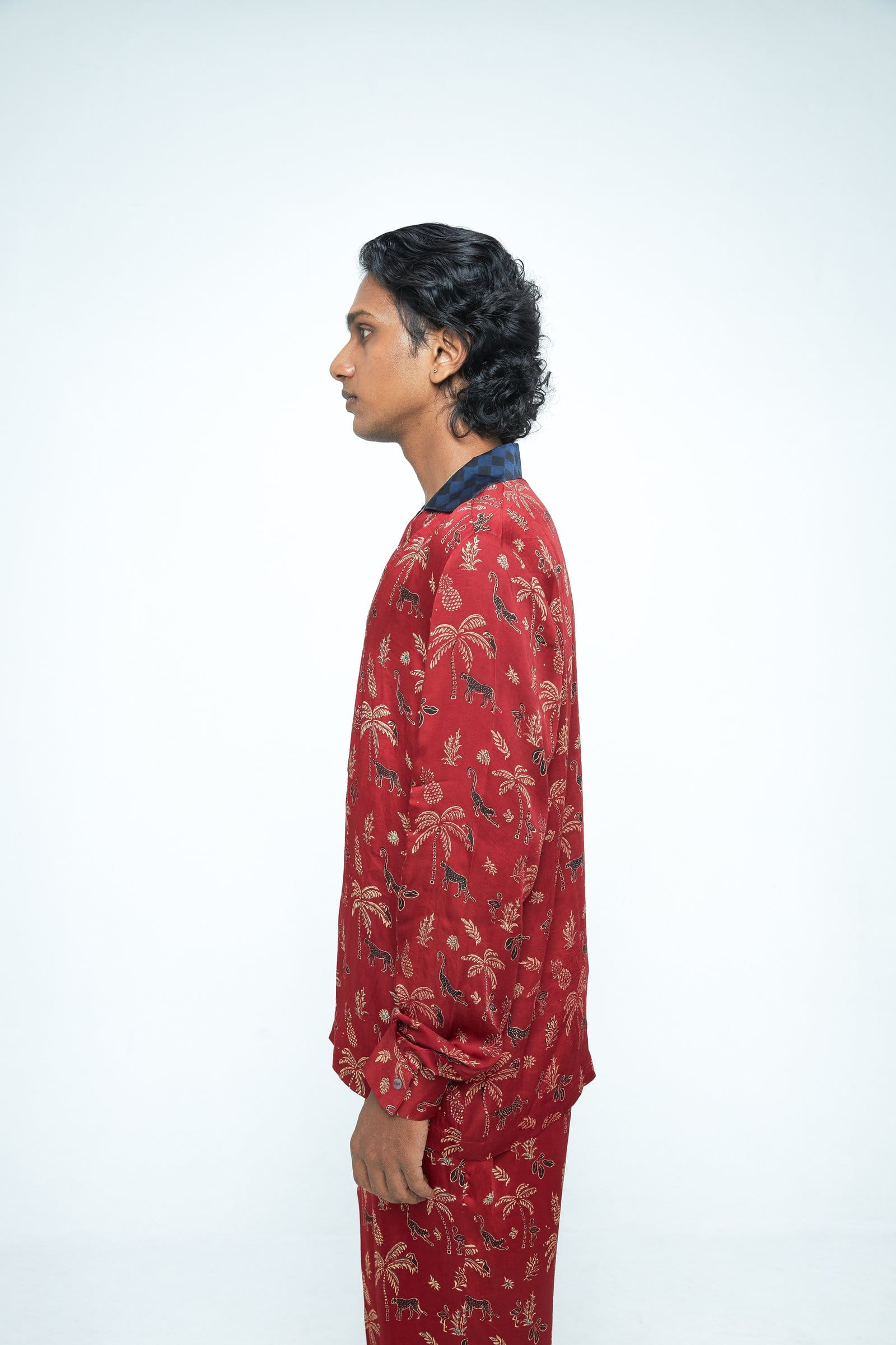 Side view of Anushe Pirani Wild T-shirt displaying its fit and design details on a plain background.