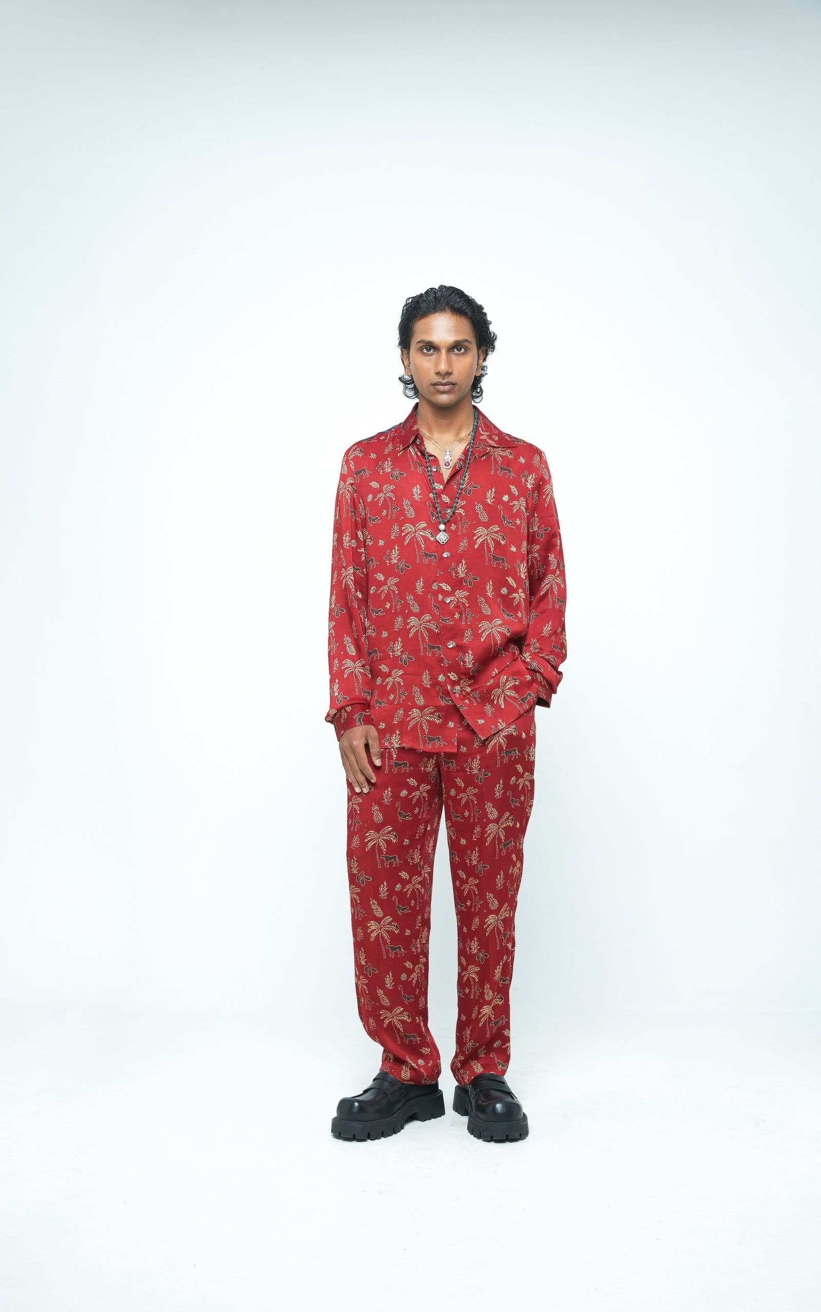 Anushe Pirani jungle shirt featuring vibrant jungle print with a collar and long sleeves, displayed from the front view.