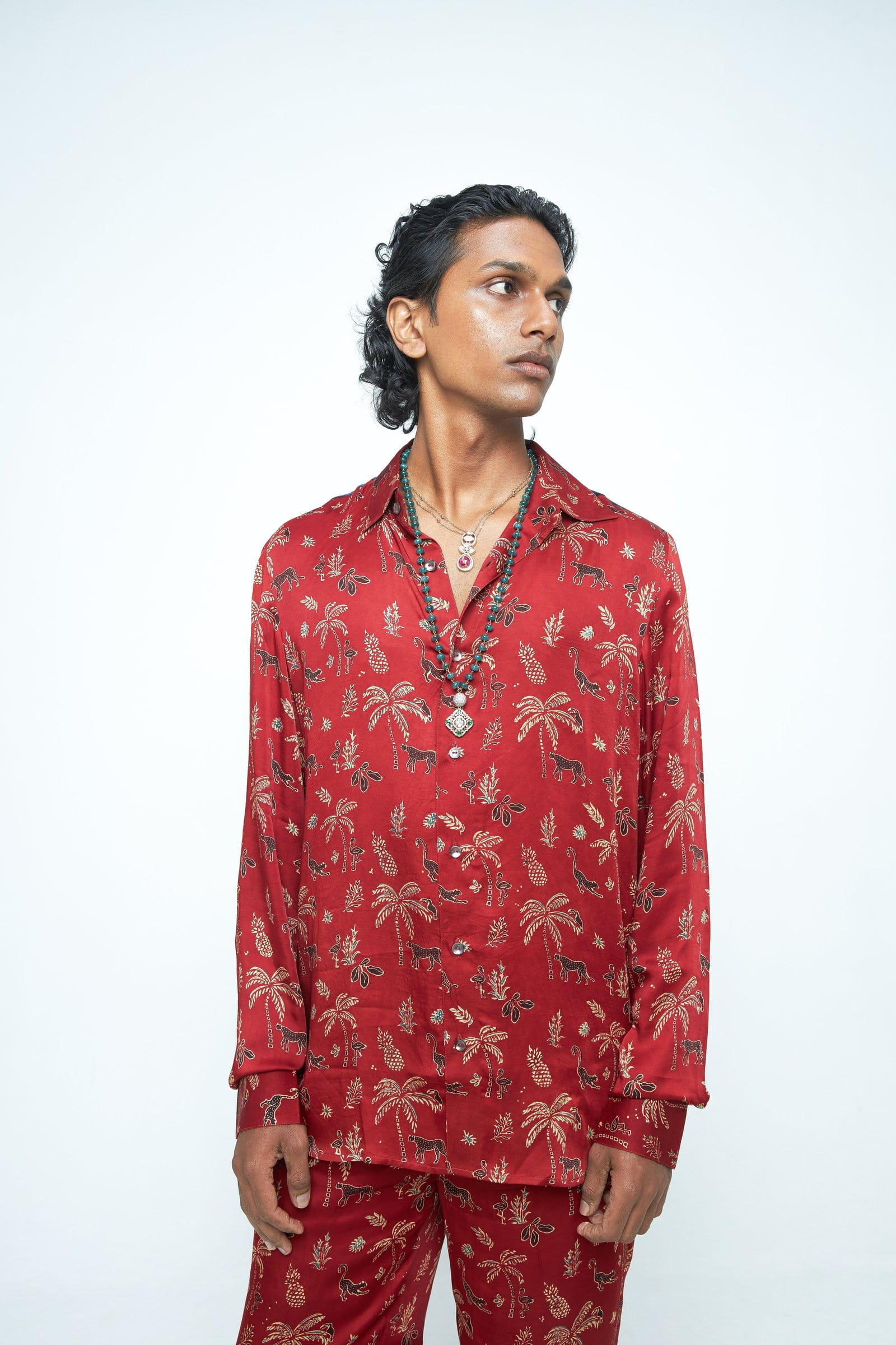 Anushe Pirani jungle shirt featuring a vibrant jungle print, long sleeves, and a classic button-up design.