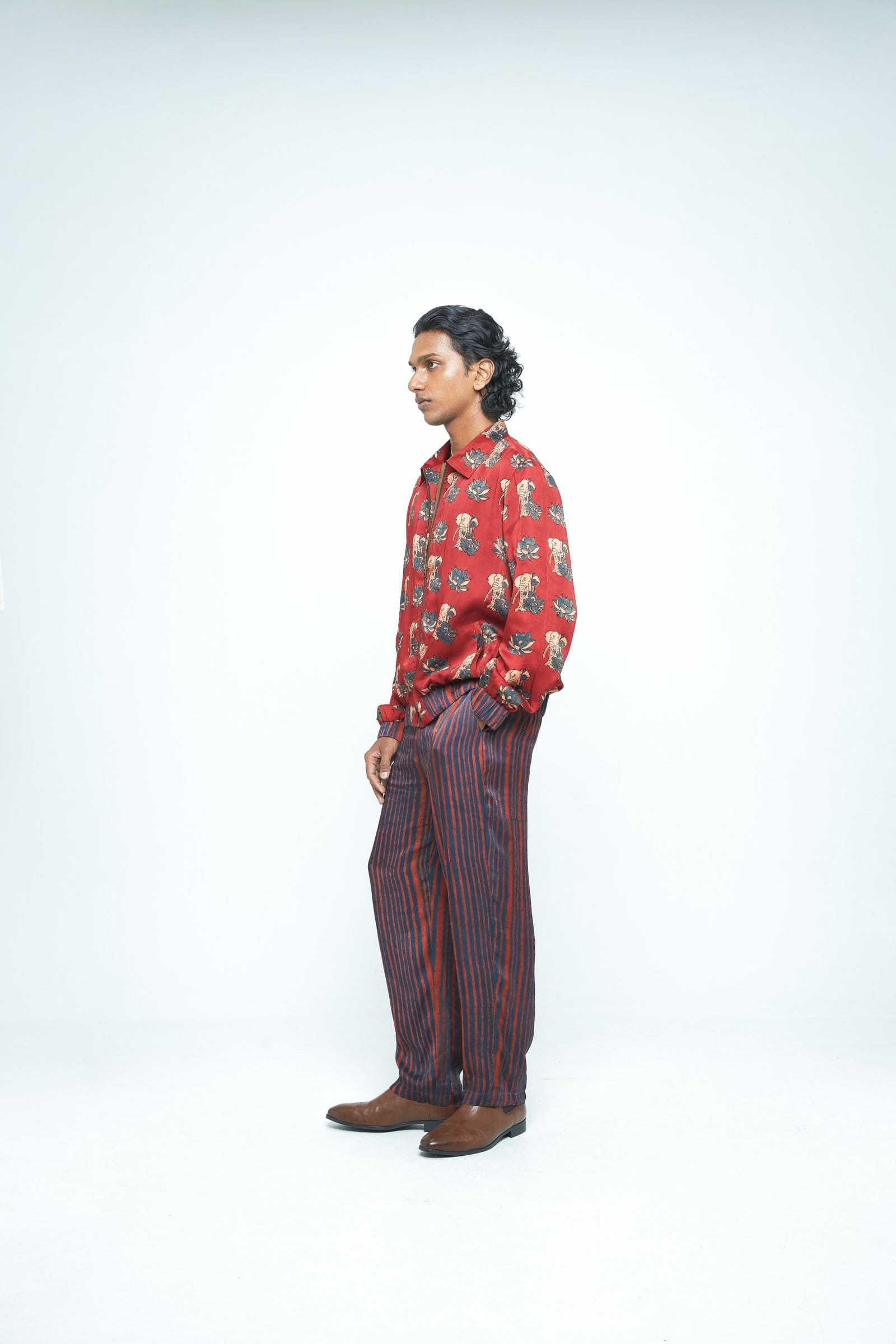 Rustic bomber jacket by Anushe Pirani with a textured, earthy fabric and casual style, shown from side view.