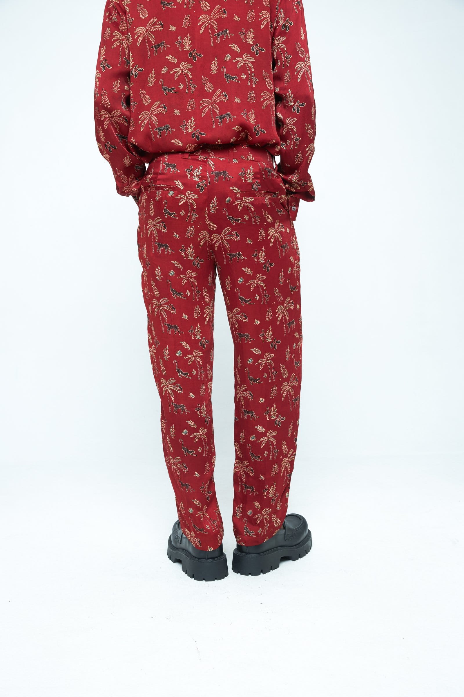 Back view of Anushe Pirani Wild tapered pants showing relaxed fit and tapered leg design in soft fabric.