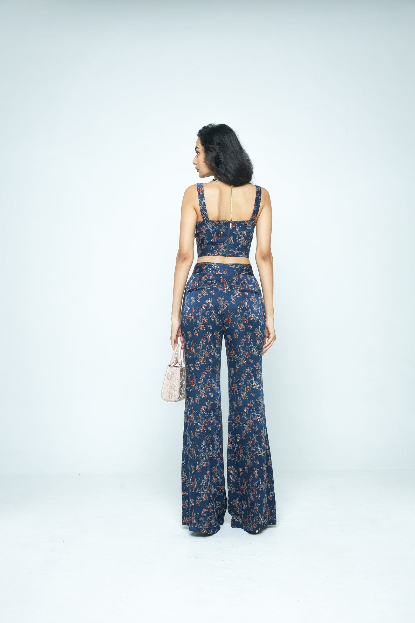 Back view of Anushe Pirani Bloom corset top featuring intricate floral embroidery and fitted design.
