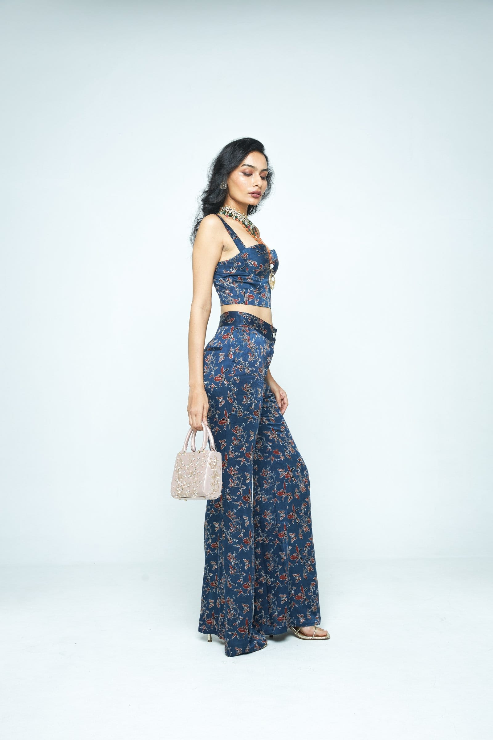 Side view of Anushe Pirani Bloom corset top, showcasing its fitted design and elegant construction.