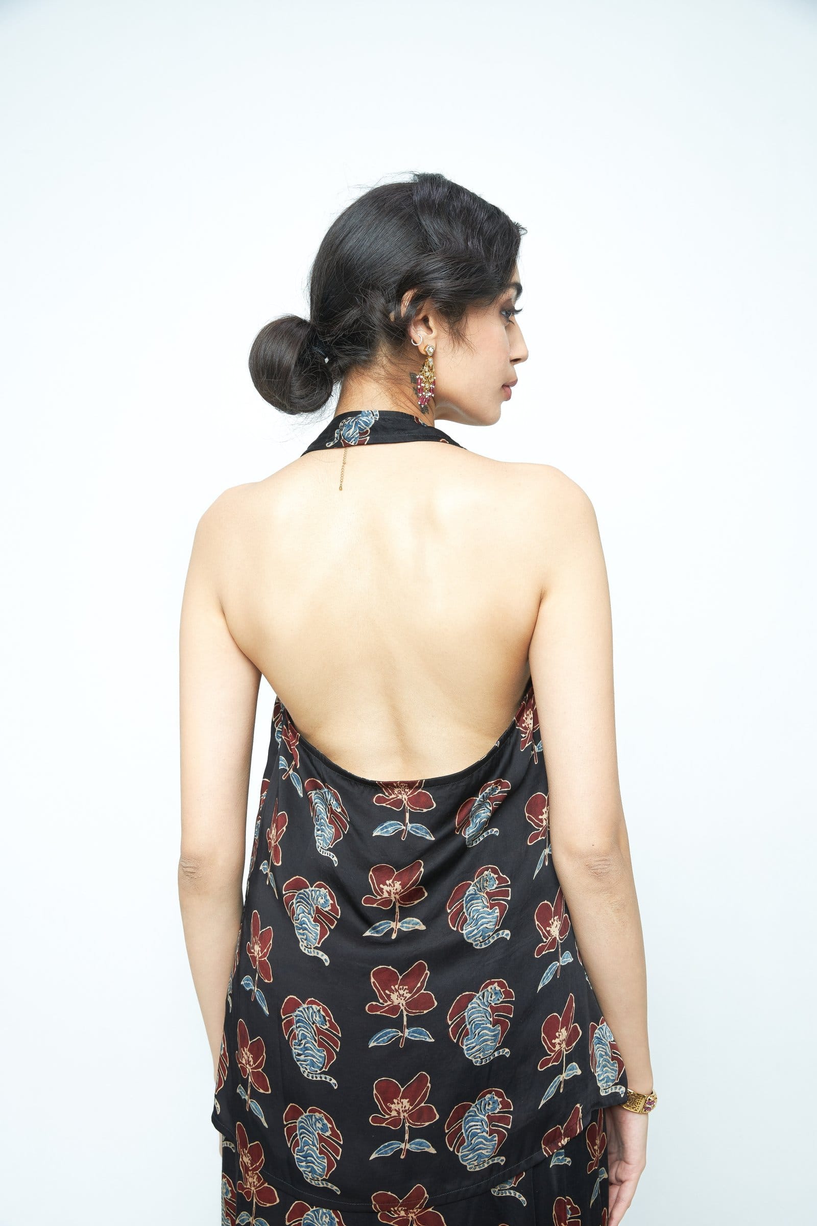 Back view of Anushe Pirani bold halter top, showcasing its stylish design and fabric details.