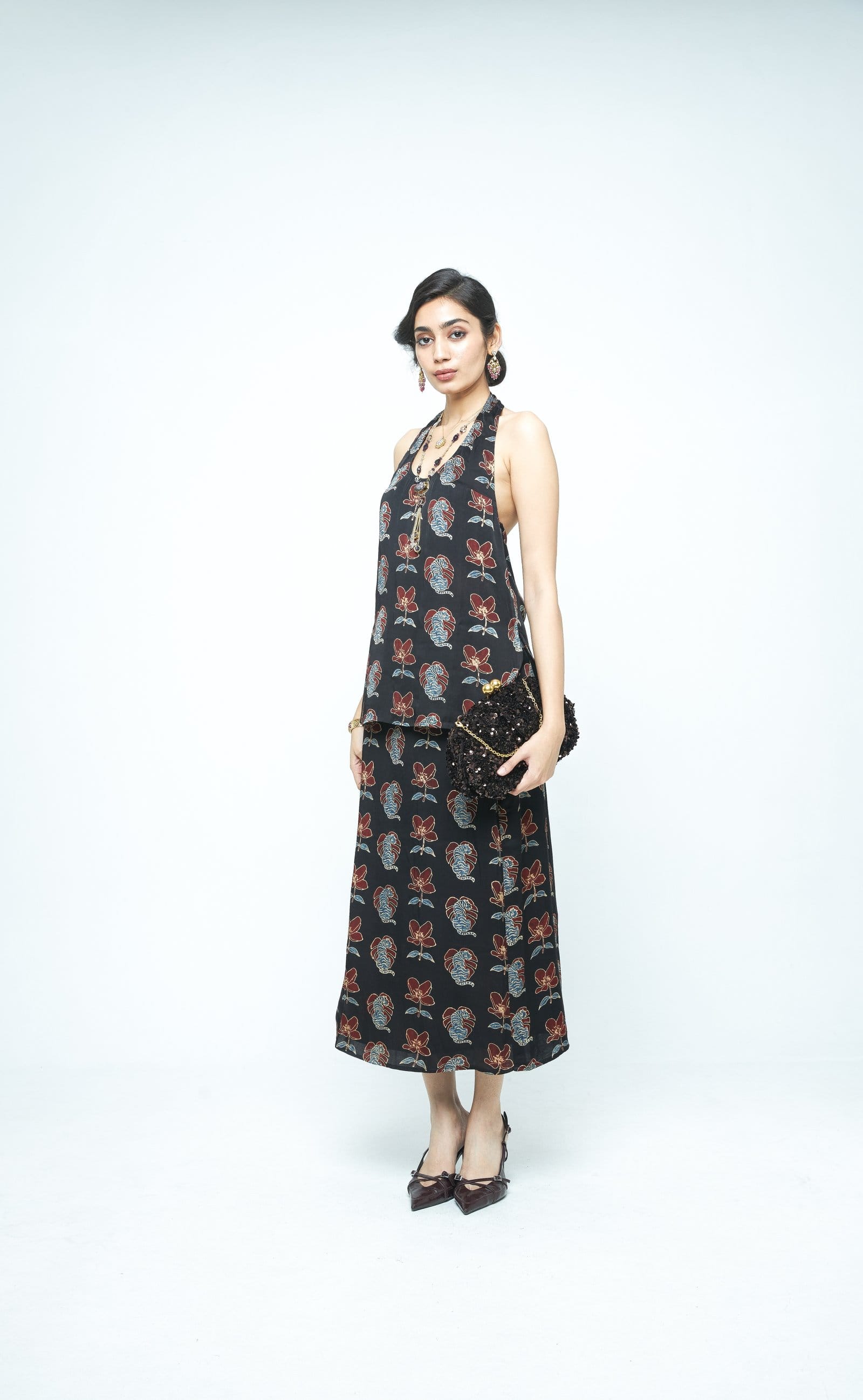 Side view of Anushe Pirani bold halter top, showcasing its stylish design and fit.