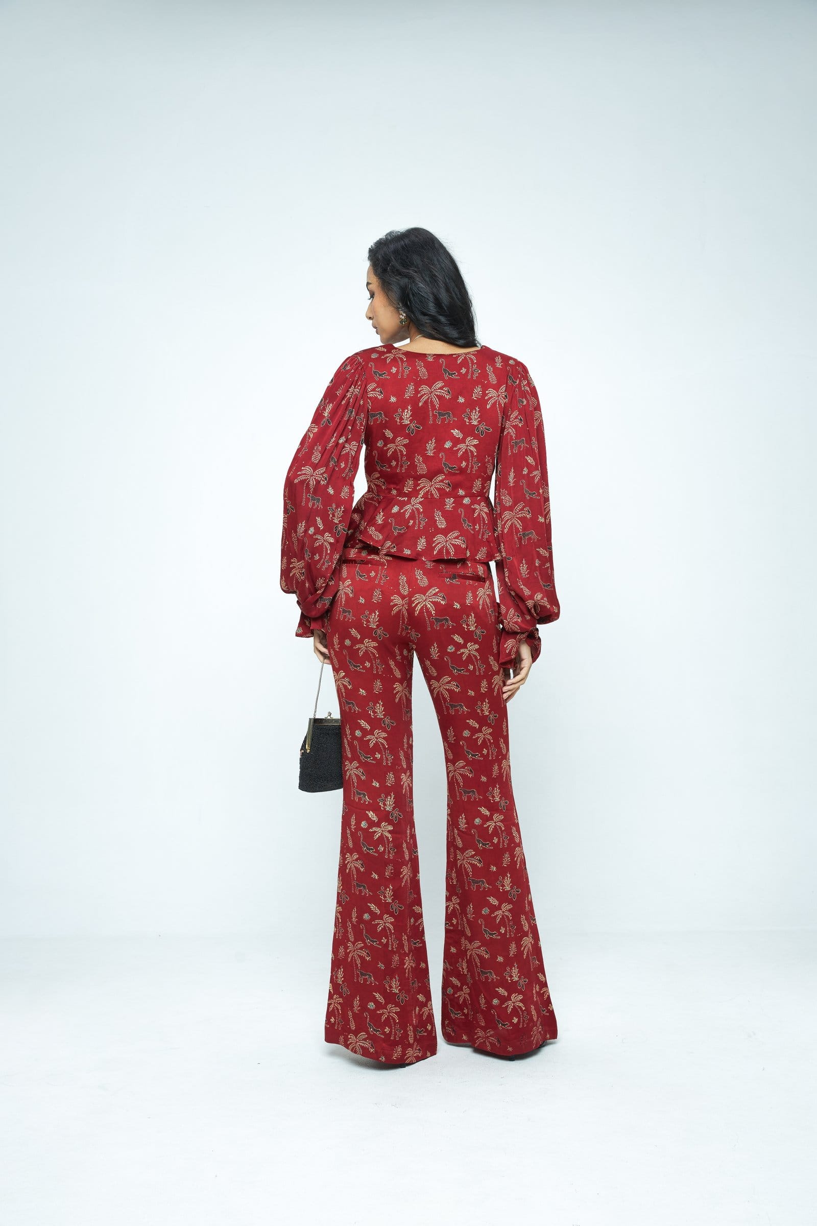 Anushe Pirani Cascade top shown from the back, featuring a stylish design with a fitted silhouette and intricate detailing.