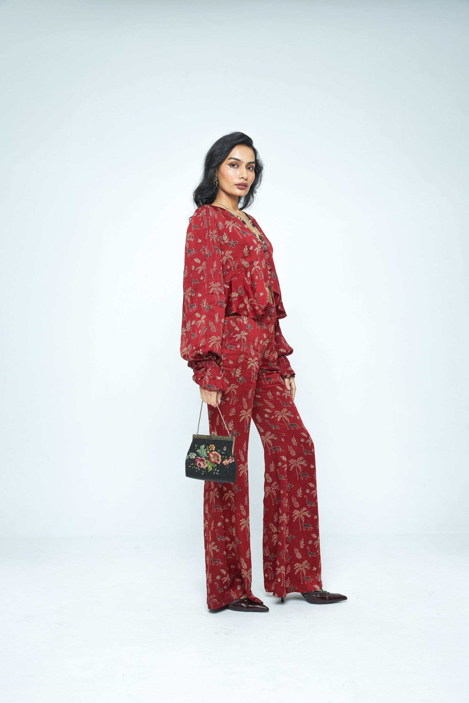 Anushe Pirani Cascade top shown from side view, featuring a stylish, flowing design in soft fabric.