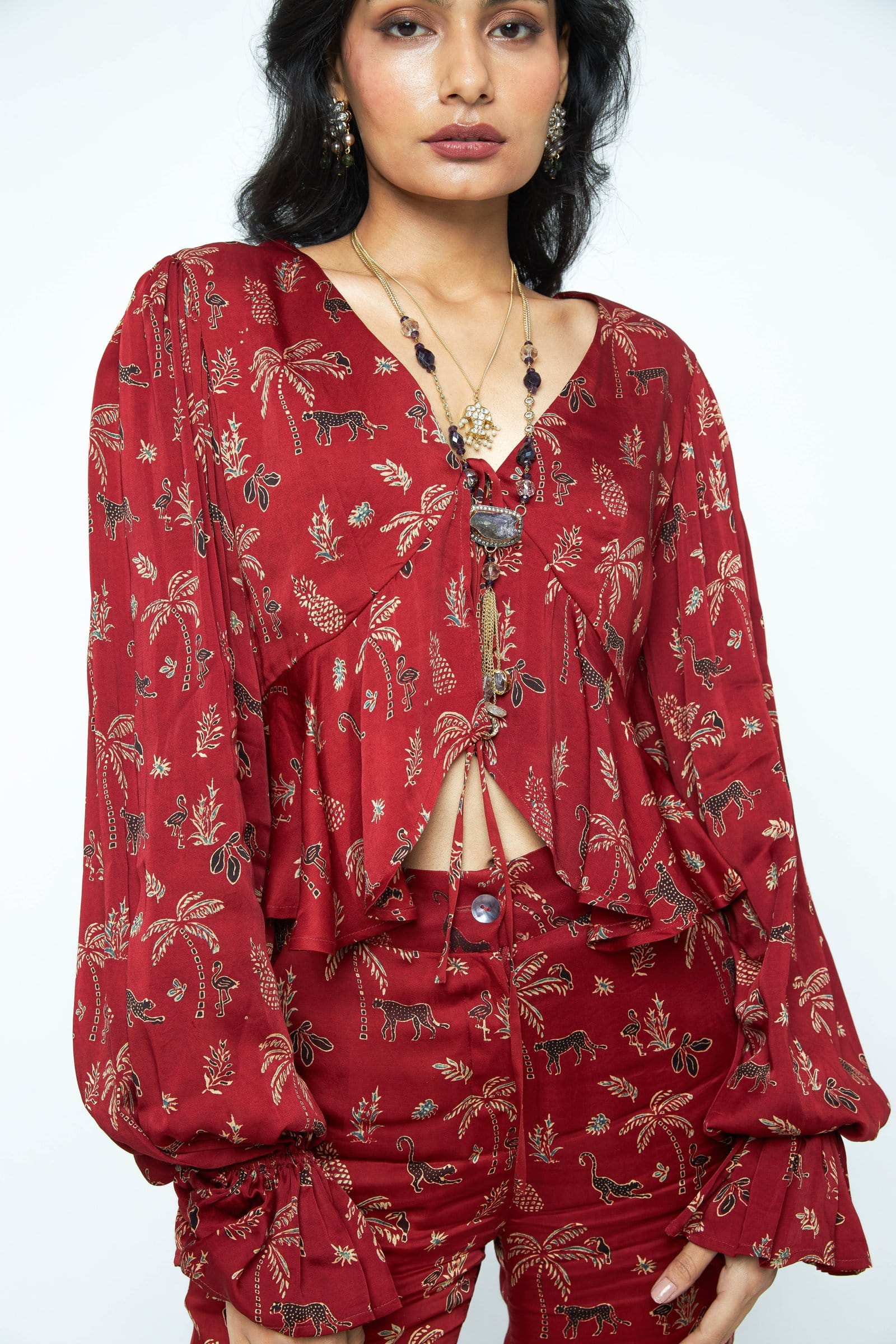 Anushe Pirani Cascade top featuring a stylish front view with a modern design and elegant fabric.