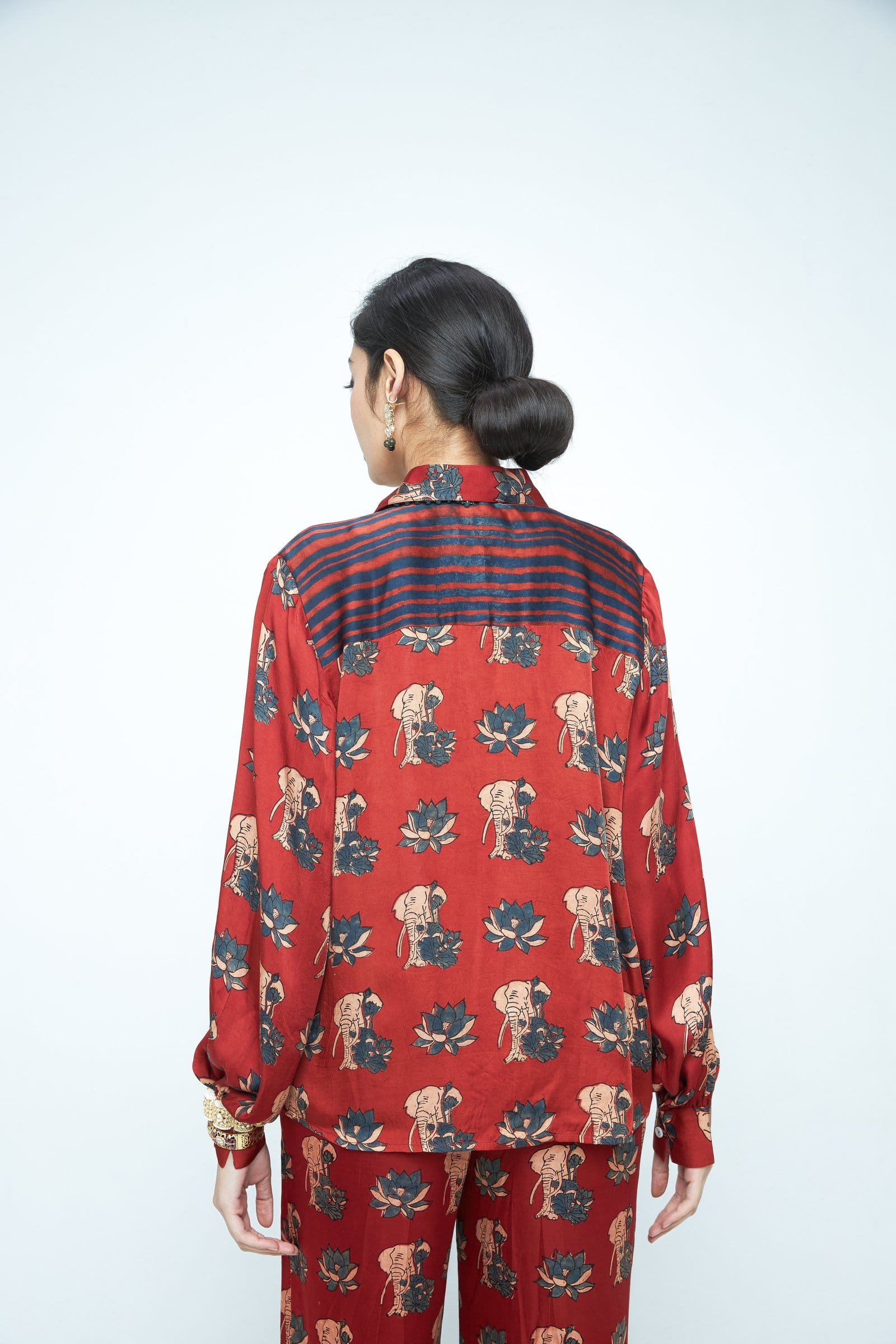 Back view of Anushe Pirani Lotus shirt, a stylish casual shirt with floral lotus design and button details.