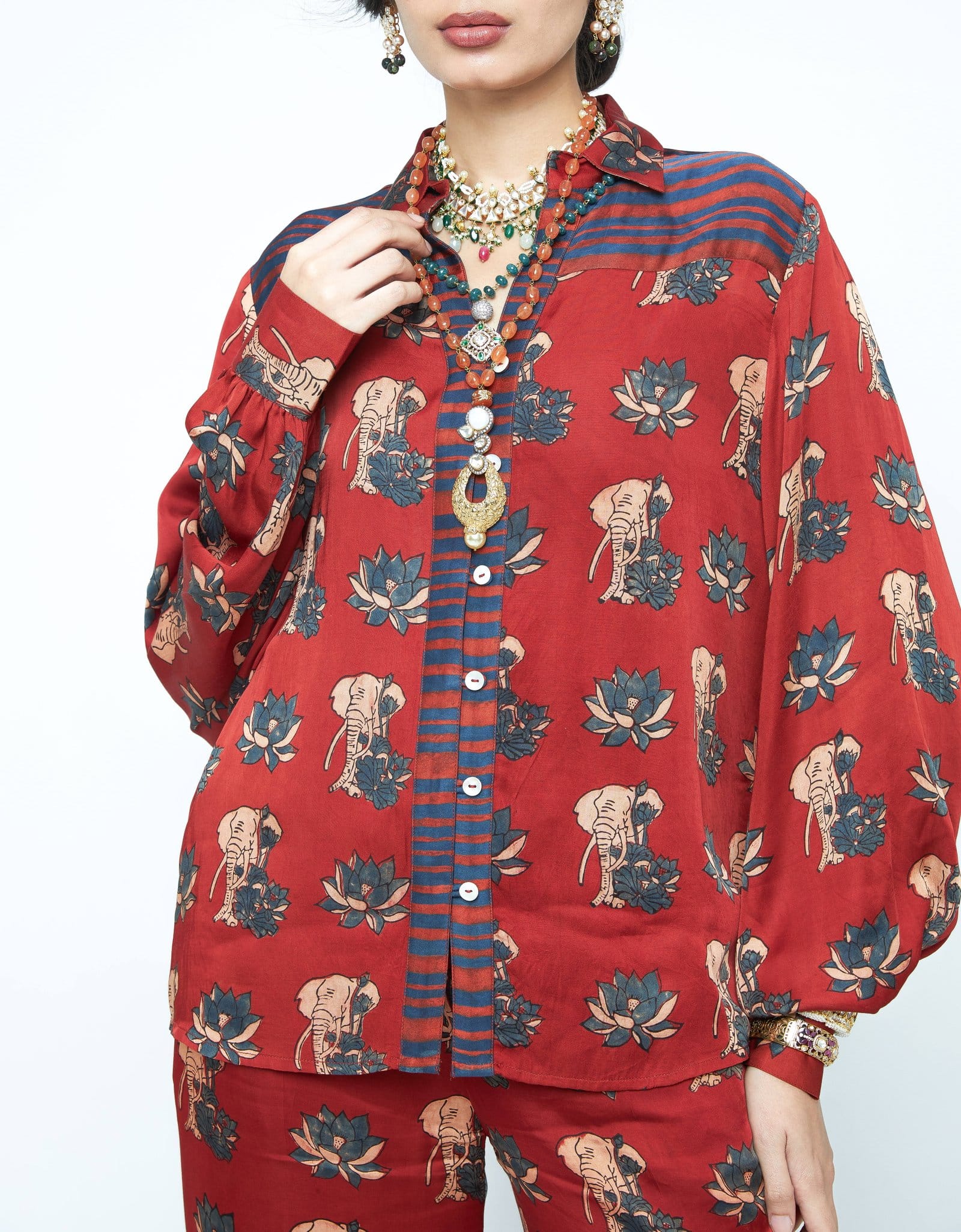 Anushe Pirani Lotus shirt featuring a vibrant lotus flower design on a stylish shirt front view.
