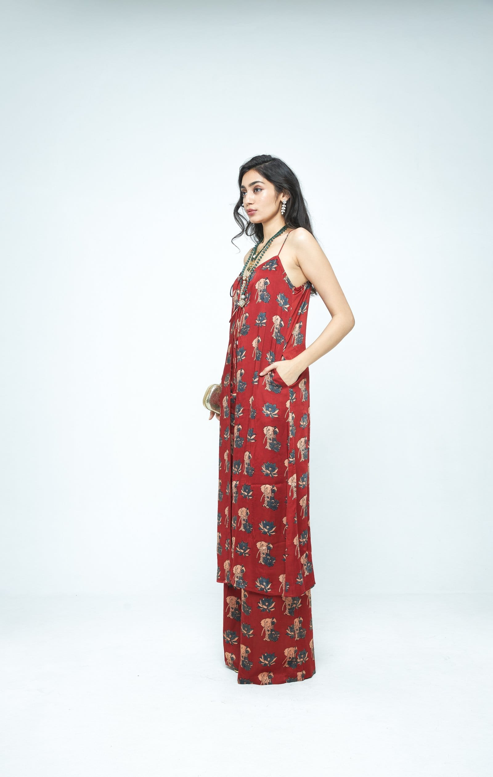 Side view of Anushe Pirani gentle tunic with flowing fabric and relaxed fit, showcasing its elegant design and soft material.
