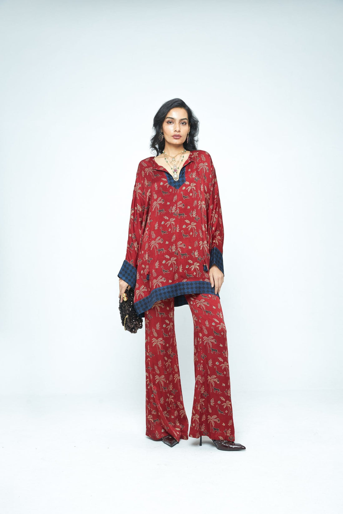 Anushe Pirani dolman sleeve tunic with relaxed fit and front view, showcasing soft fabric and stylish design.