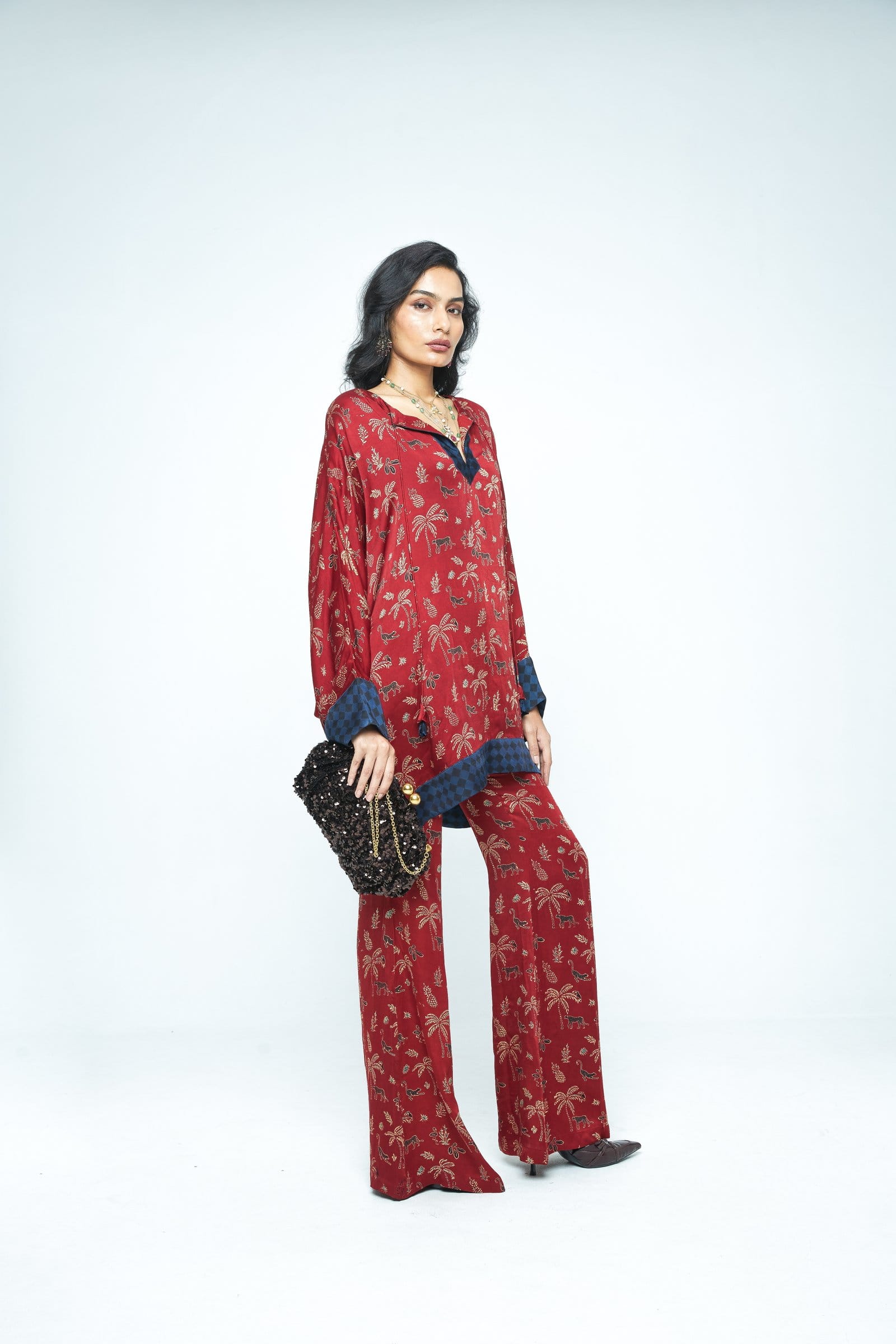 Side view of Anushe Pirani Dolman sleeve tunic, showing its relaxed fit, flowing fabric, and stylish design.