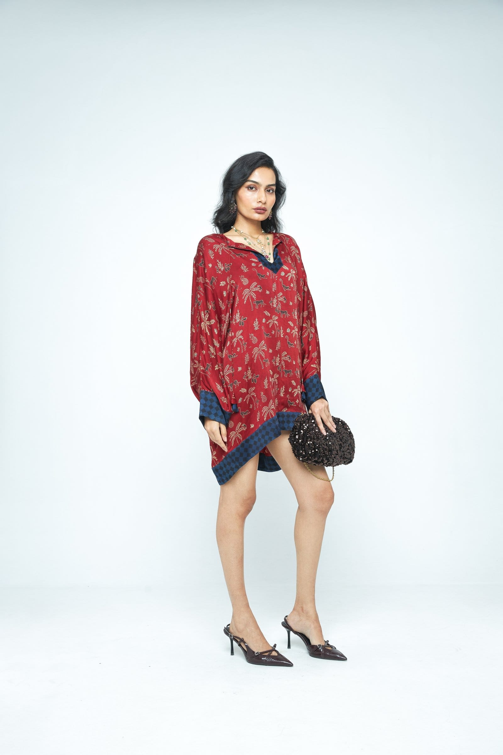 Anushe Pirani dolman sleeve tunic shown from the side, featuring a relaxed fit and stylish design in soft fabric.