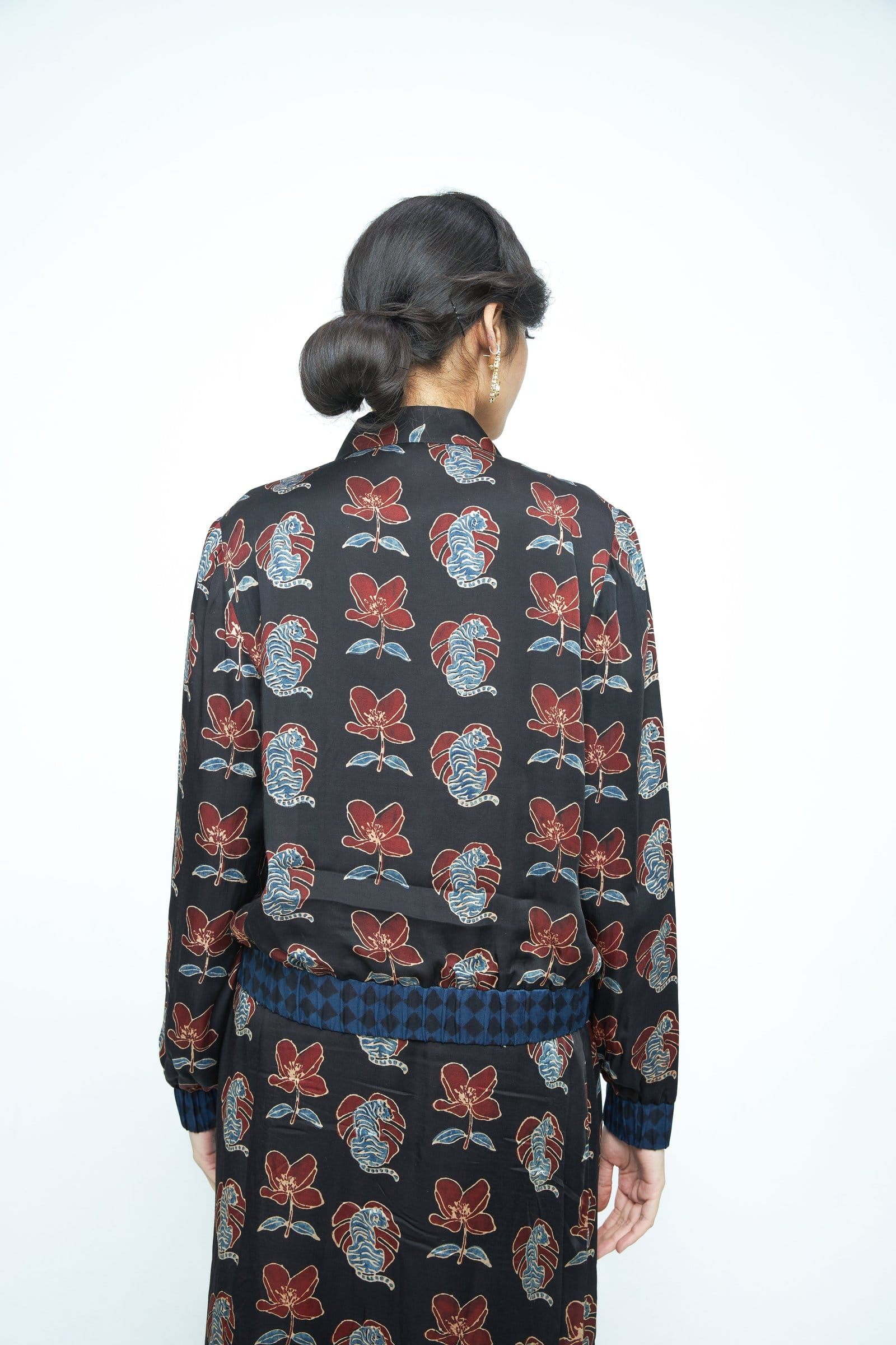 Back view of Anushe Pirani Beast Bomber jacket in black, showcasing the stylish design and fitted silhouette.