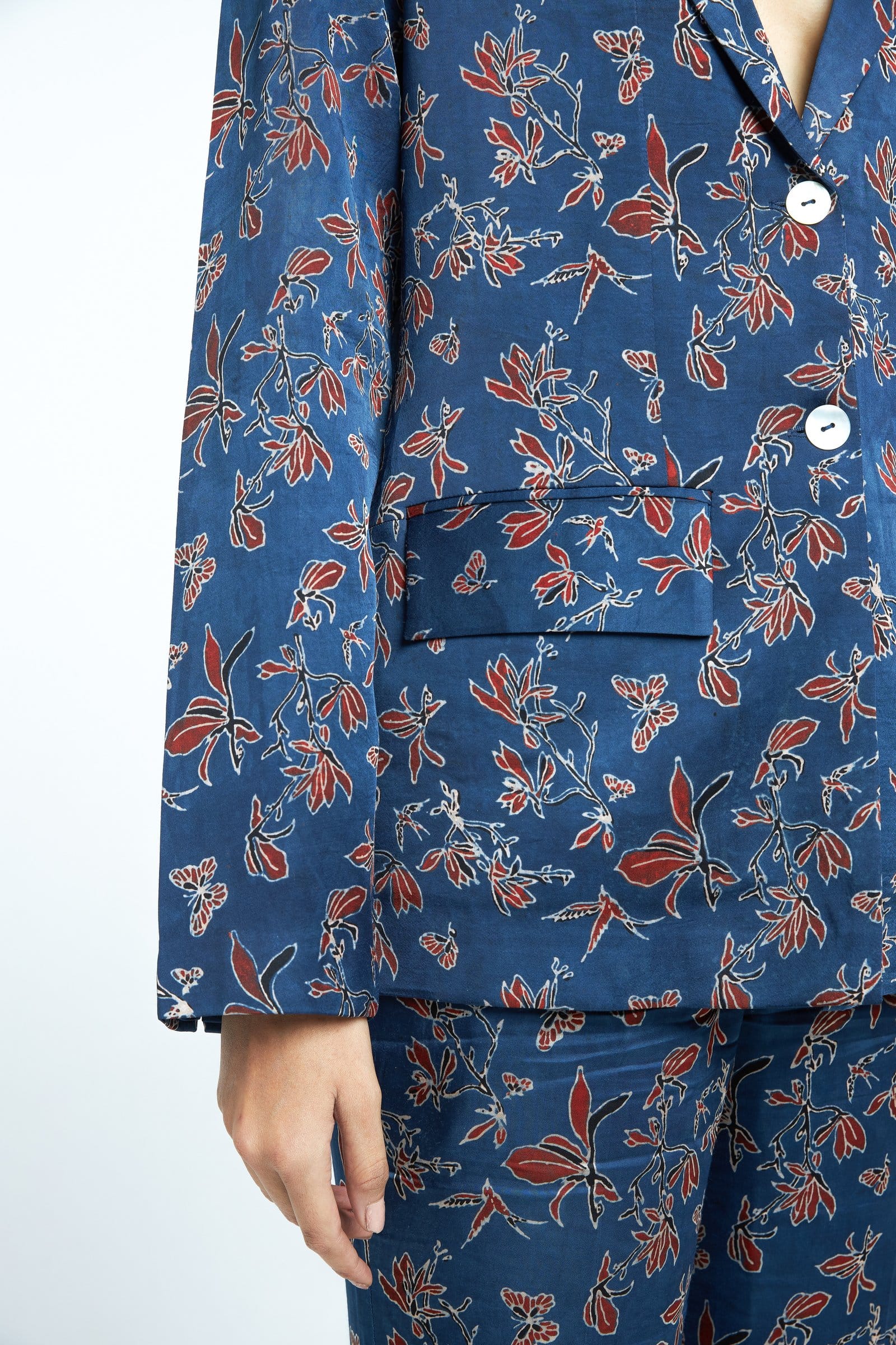 Anushe Pirani Paradise blazer featuring tailored fit, classic lapels, and stylish design, shown on a hanger.