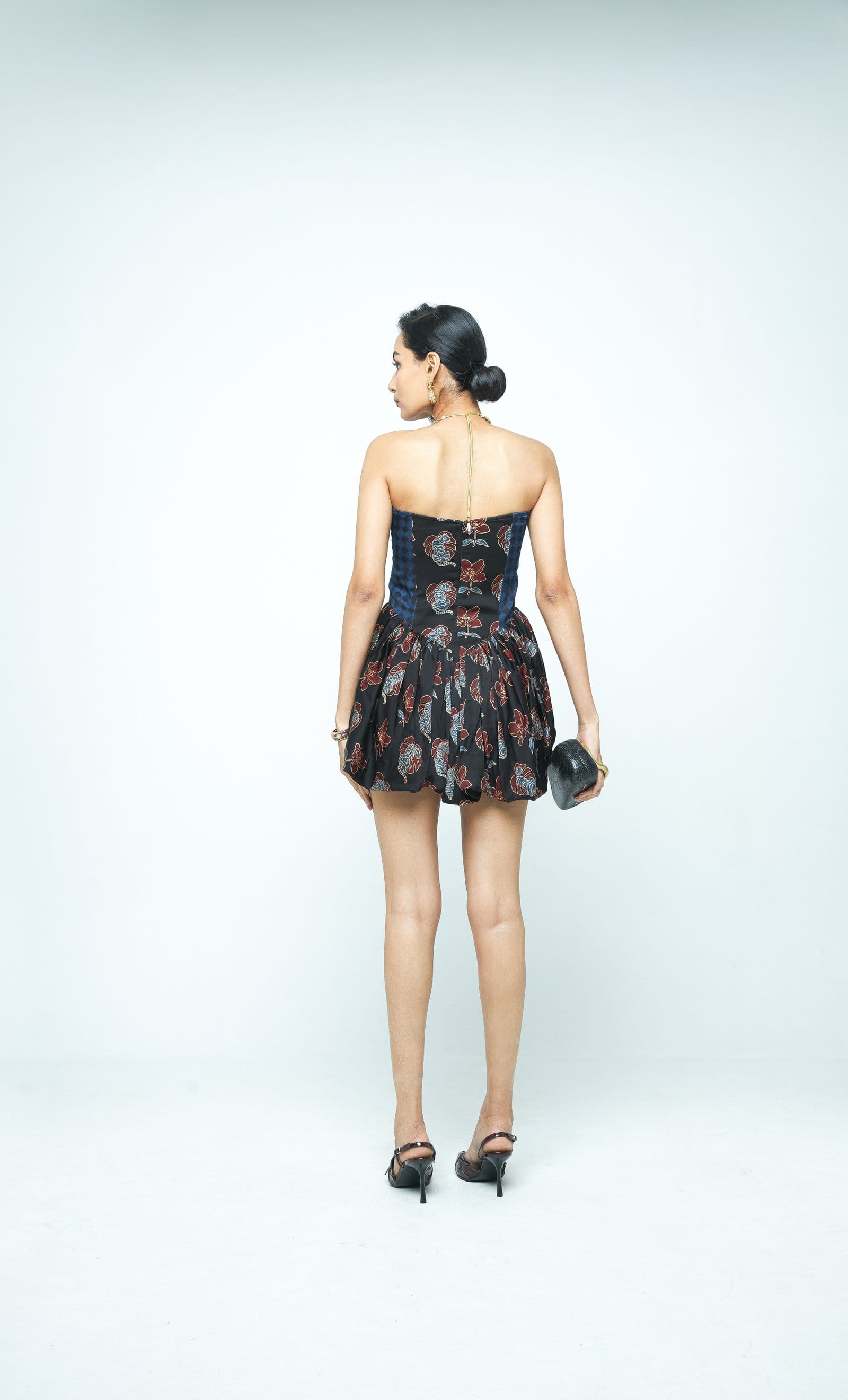 Back view of Anushe Pirani Sculpt & Bloom Mini Dress featuring a fitted silhouette and elegant design.