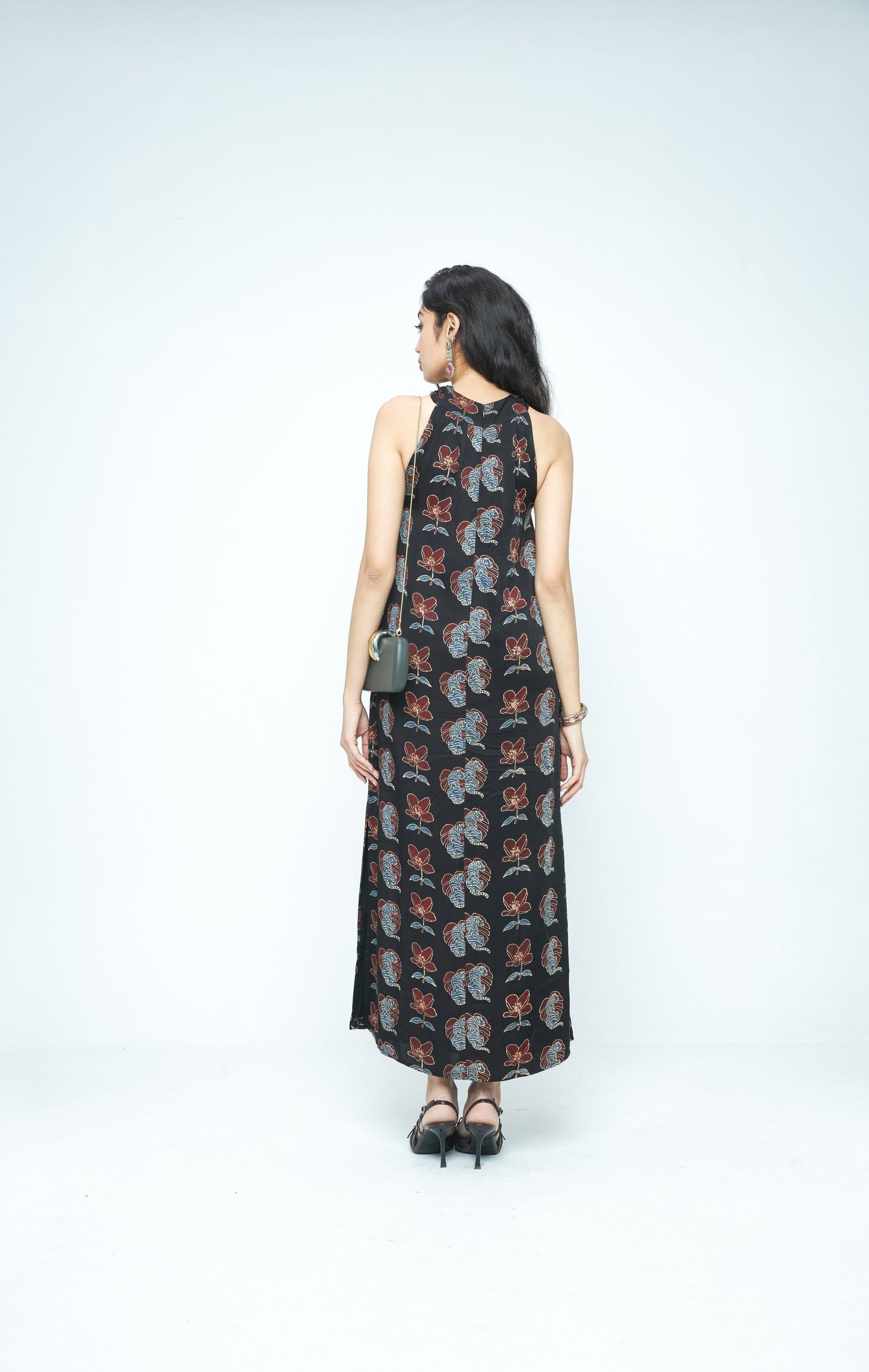 Back view of The Knot Dress by Anushe Pirani, featuring a stylish, fitted design with knot detailing at the back.