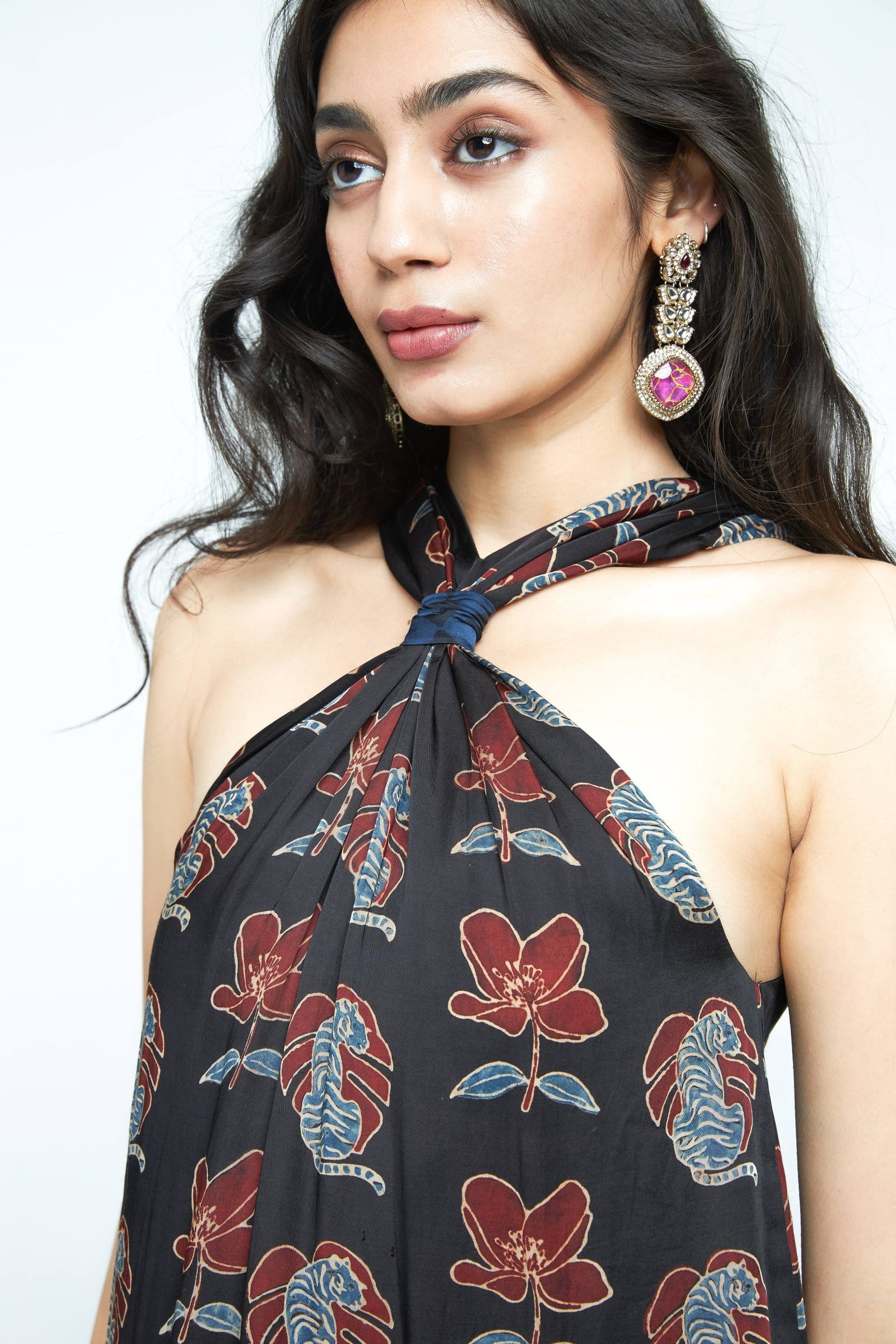 Close-up of the Anushe Pirani Knot Dress showing intricate knot details and fabric texture.
