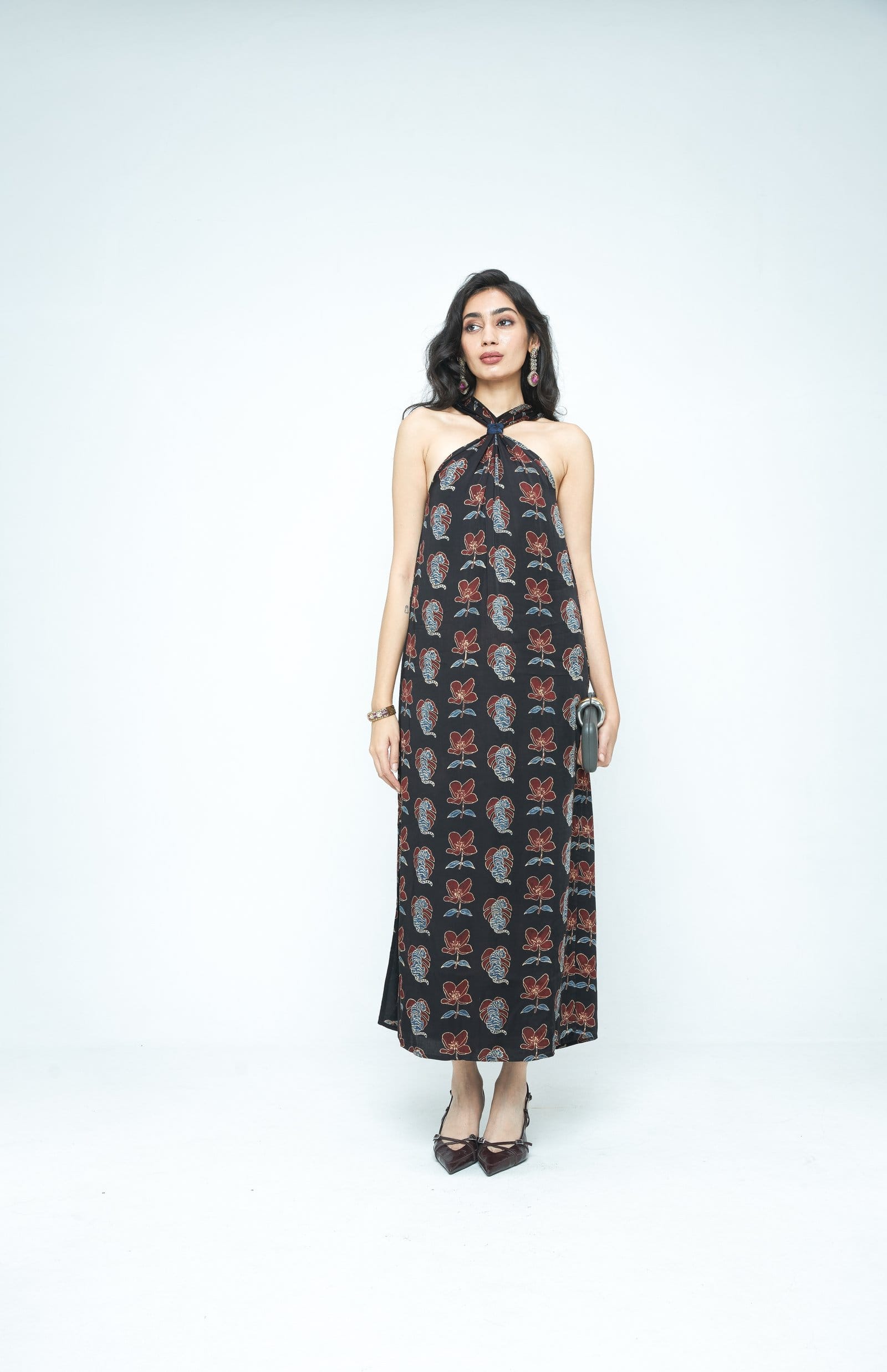 Front view of Anushe Pirani The Knot Dress in a stylish, fitted design with ruched detailing and a tie-front feature.