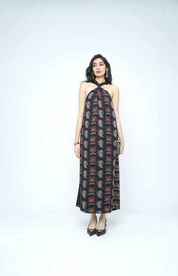 Front view of Anushe Pirani The Knot Dress in a stylish, fitted design with ruched detailing and a tie-front feature.