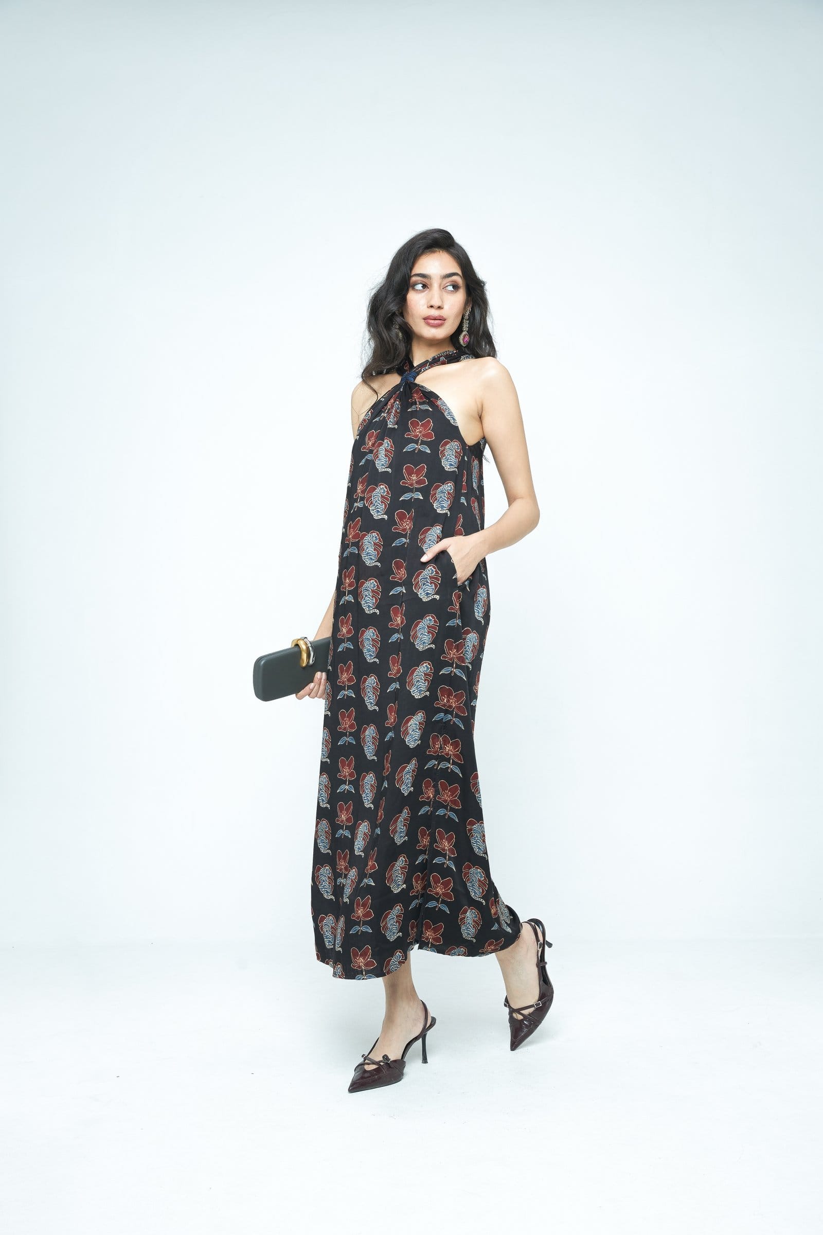 Side view of The Knot Dress by Anushe Pirani, showcasing its stylish design and elegant silhouette.