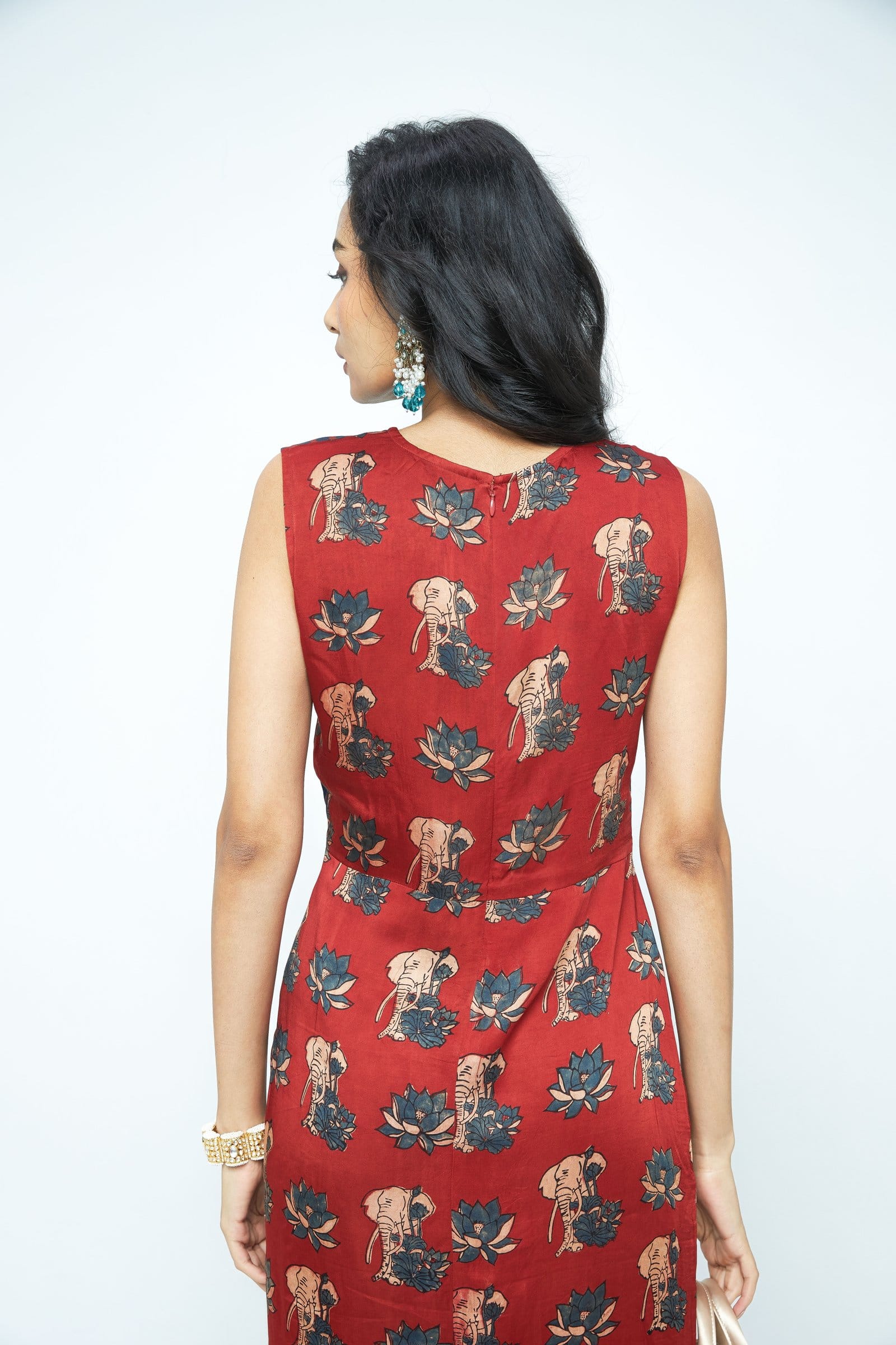 Back view of Anushe Pirani Ruché dress showing elegant fabric drape and detailed design on the upper back.