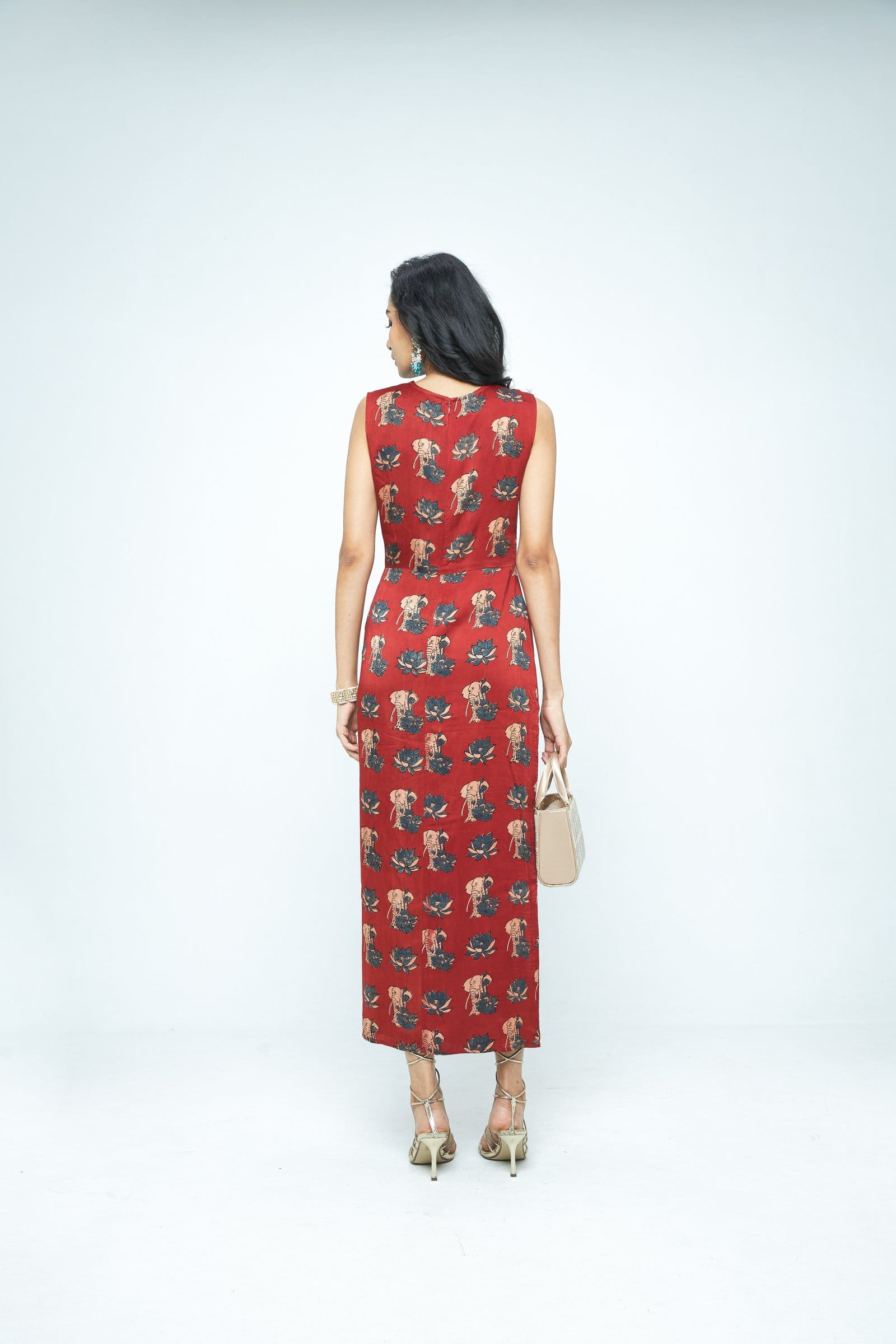 Back view of Anushe Pirani Ruché dress showcasing elegant ruching details and flowing fabric in a stylish, sophisticated design.