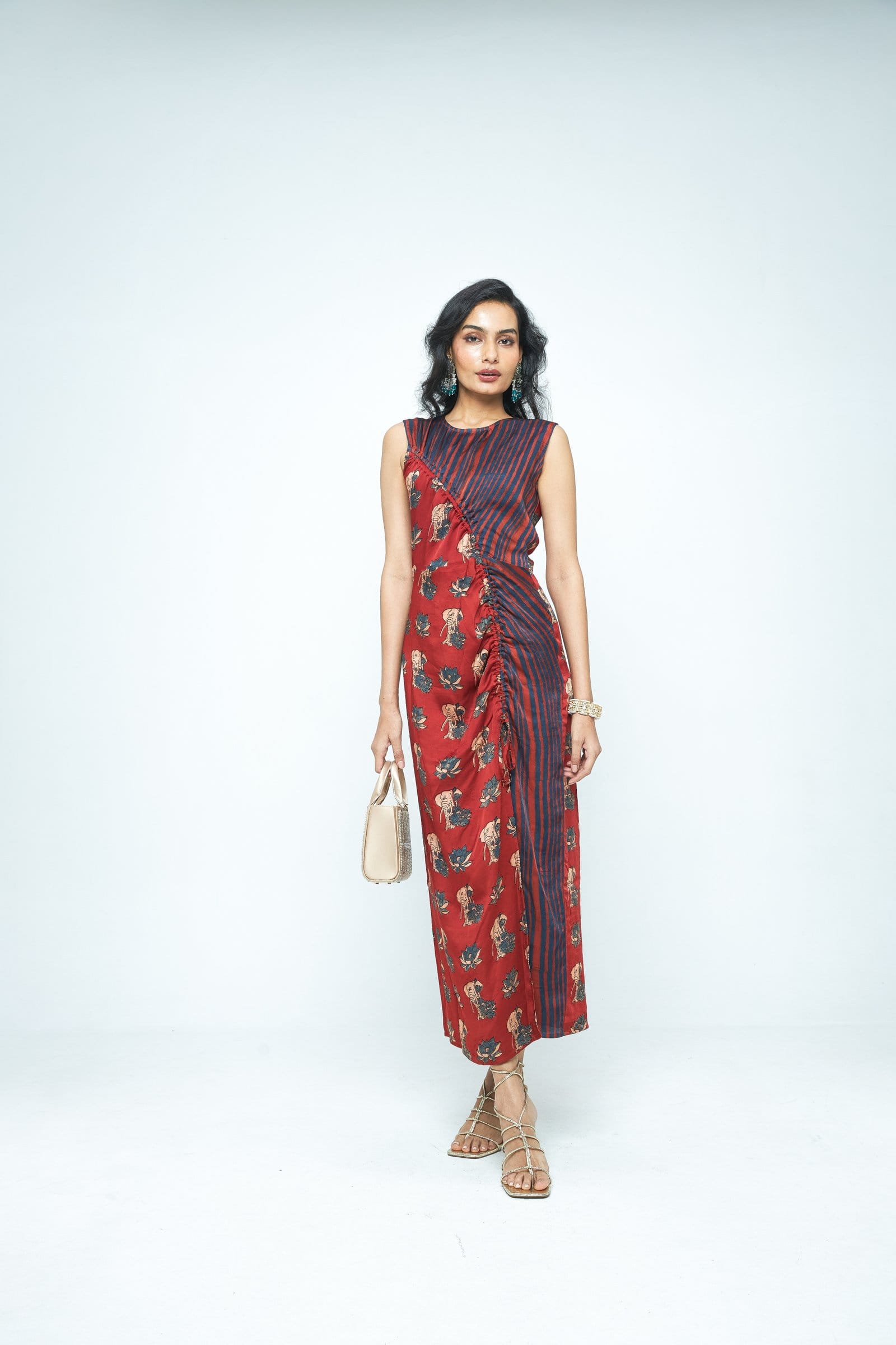 Anushe Pirani Ruché dress with flowing fabric, front view showcasing elegant design and intricate ruching details.