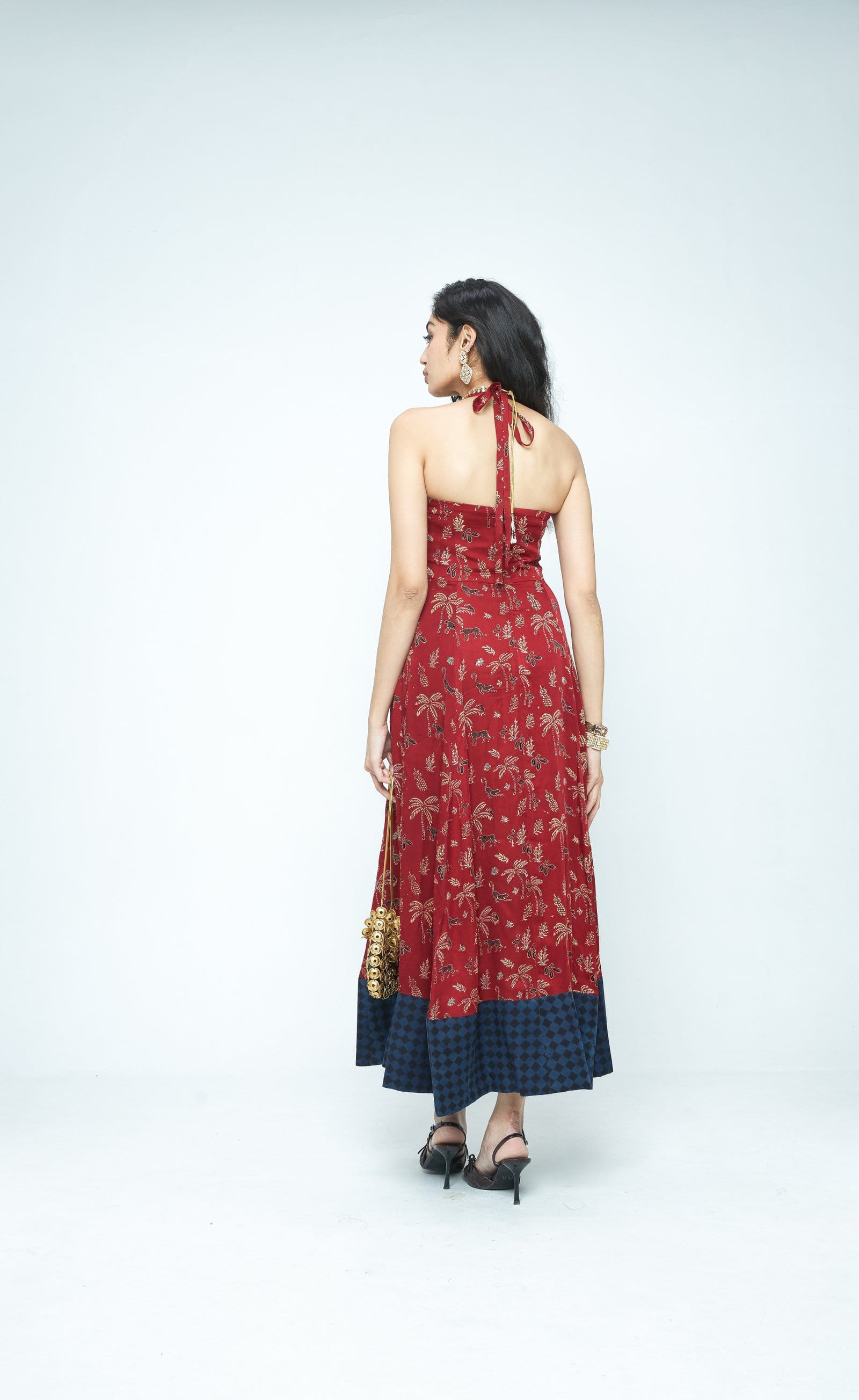 Back view of Anushe Pirani Parade flare dress, stylish and flowing design in vibrant fabric, perfect for elegant occasions.