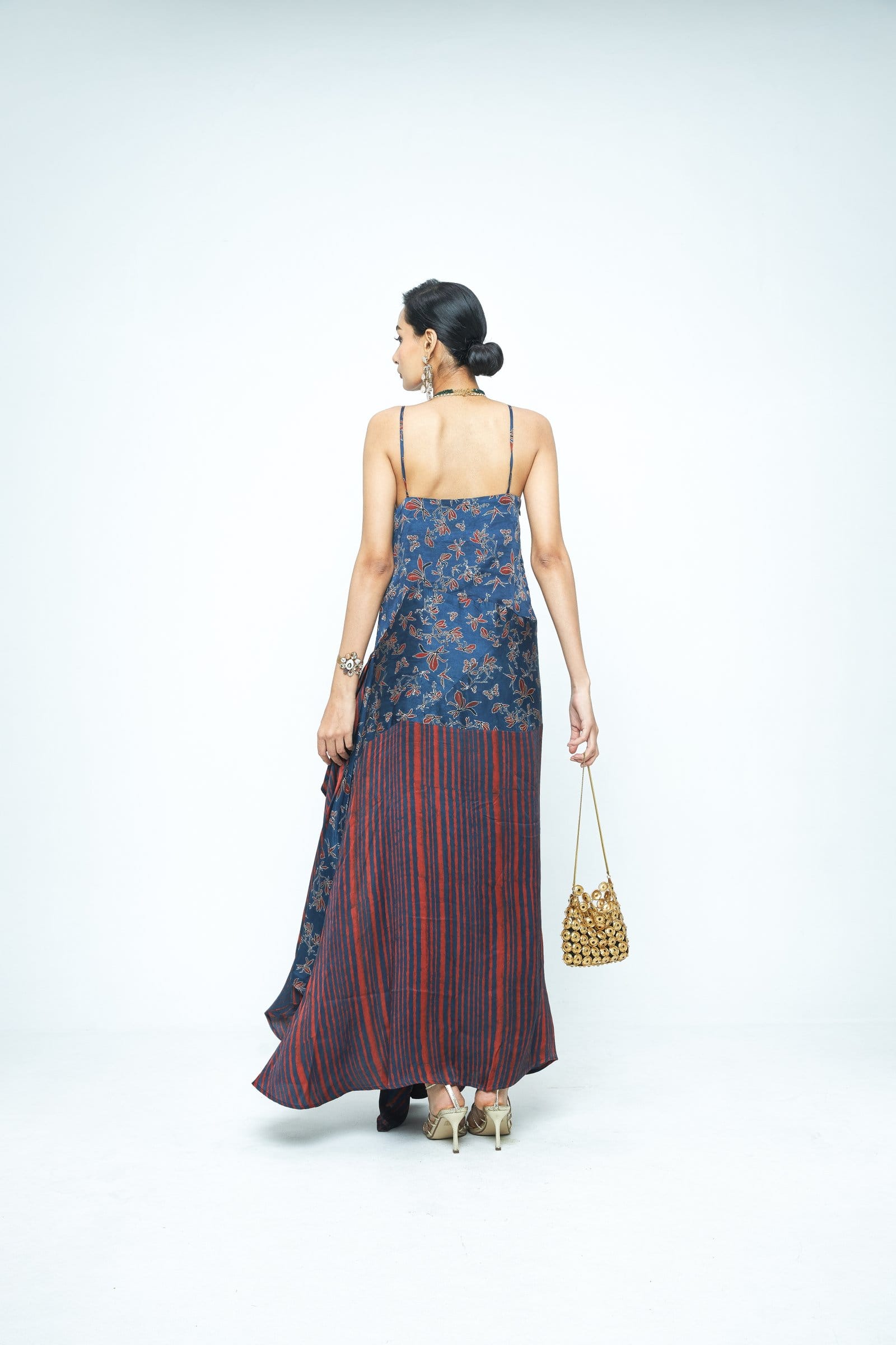 Back view of Anushe Pirani Flutter dress showcasing its elegant design and flowing fabric.