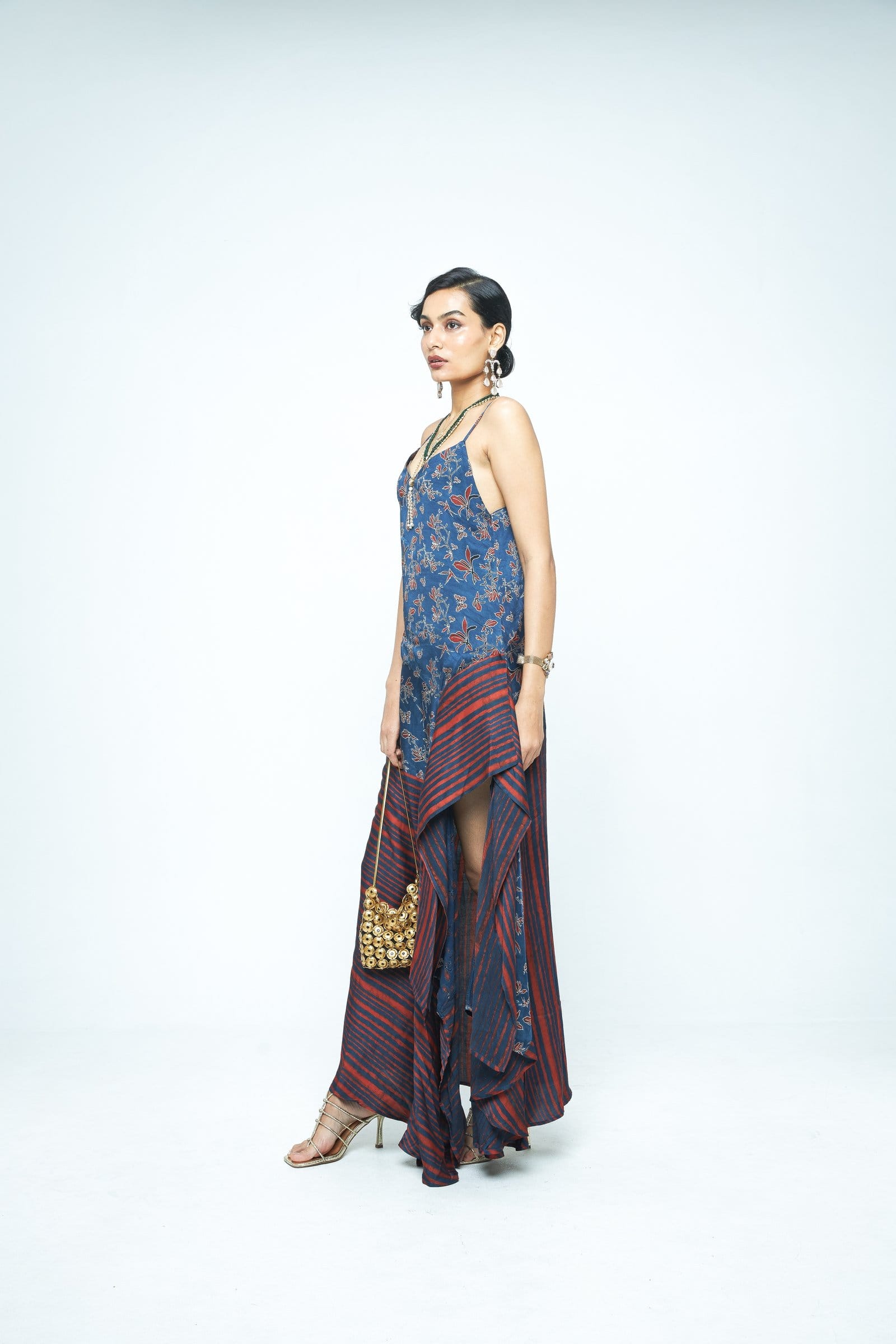 Anushe Pirani Flutter dress displayed from the side, showcasing its flowing fabric and stylish design.