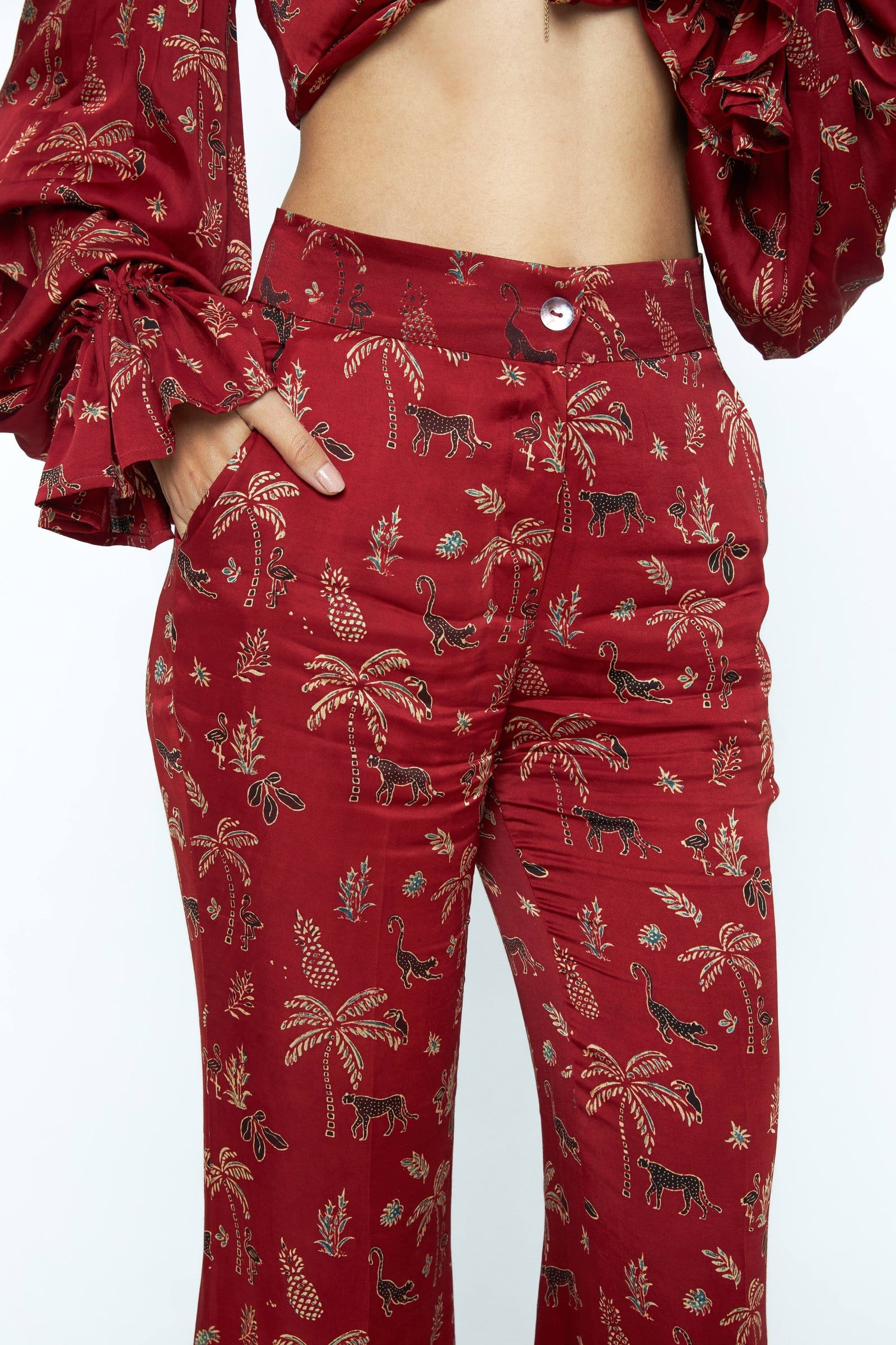 Anushe Pirani flare pants with wide legs and high waist, shown with detailed stitching and fabric texture in a close-up image.
