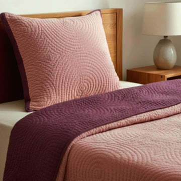 Pink velvet reversible quilt from Bombaybirds with berry pattern, soft and luxurious living bedding for cozy bedroom decor.